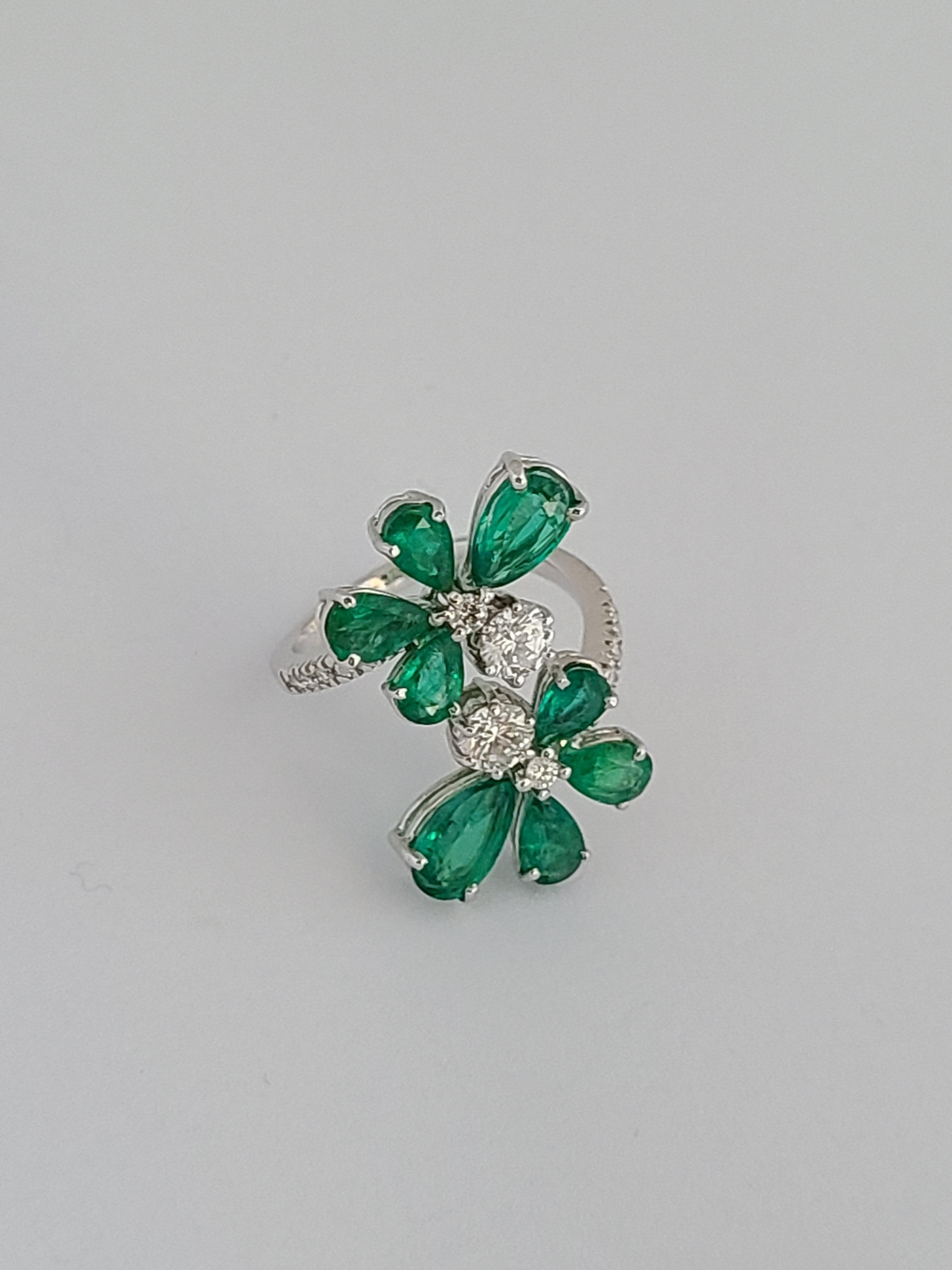 A modern and chic emerald ring set in 18k white gold with diamonds. The emerald are natural and originate from Zambia , weight of emerald is 3.32 carats and diamond weight is .84 carats. The ring dimensions in cm 2.6 x 2.6 x 2.3 (LXWXH). US 6