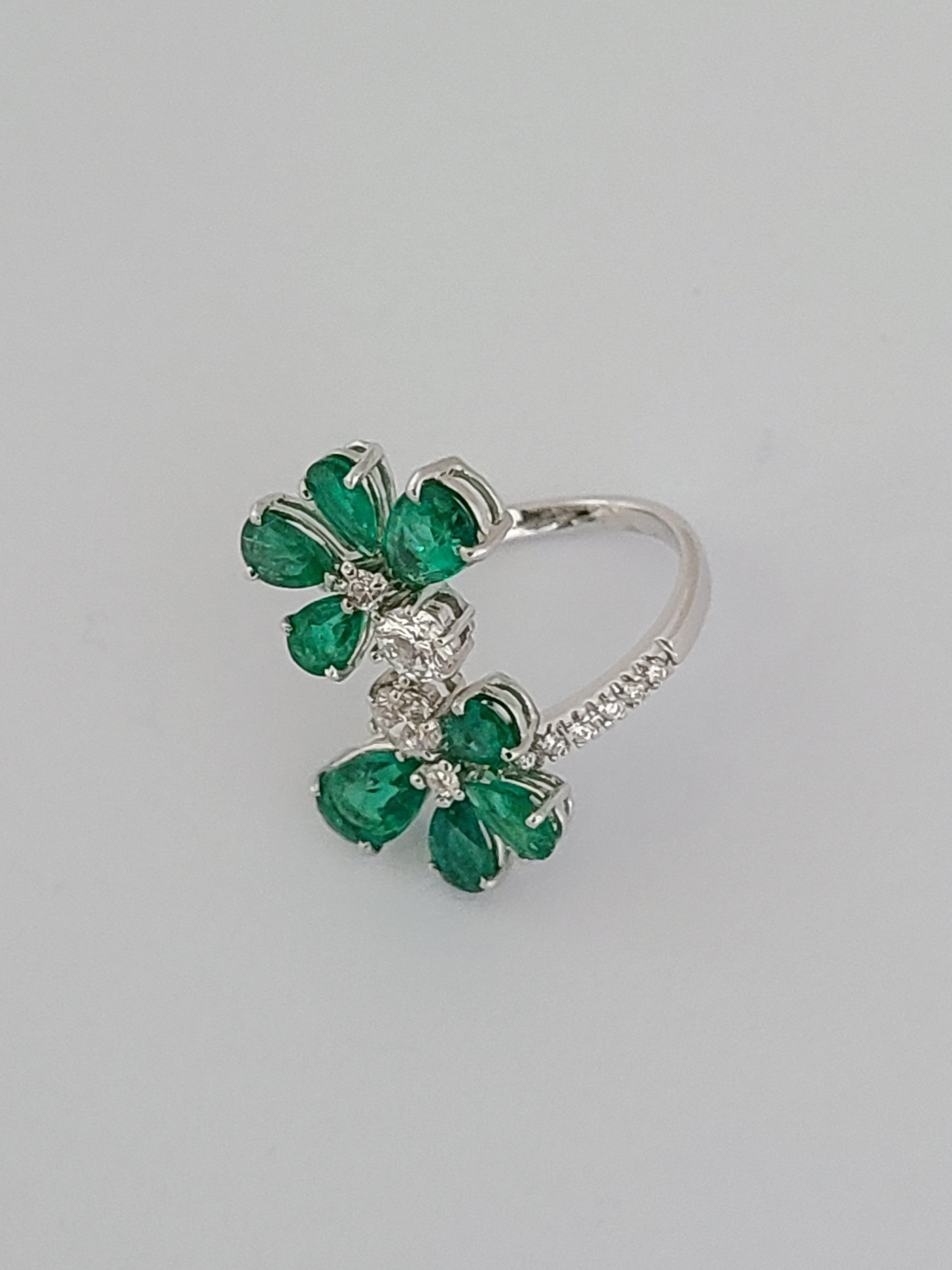 Modern Natural Emerald Pear Cut Ring with Diamonds Set in 18 Karat Gold