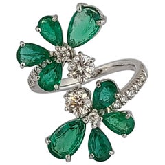 Natural Emerald Pear Cut Ring with Diamonds Set in 18 Karat Gold