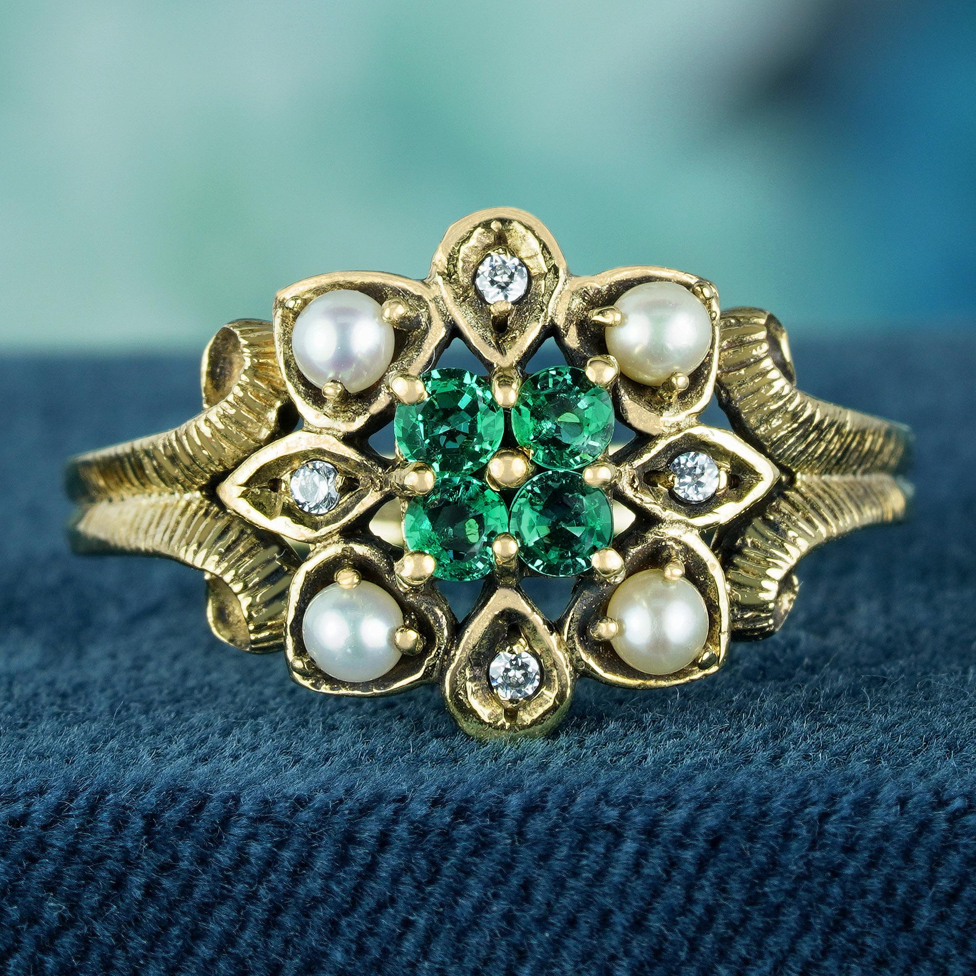 Crafted from luminous yellow gold, this mesmerizing ring boasts a central round emerald, elegantly encircled by four split pearls and four round diamonds, all delicately set in a prong setting. Adding to its allure is the intricate milgrain