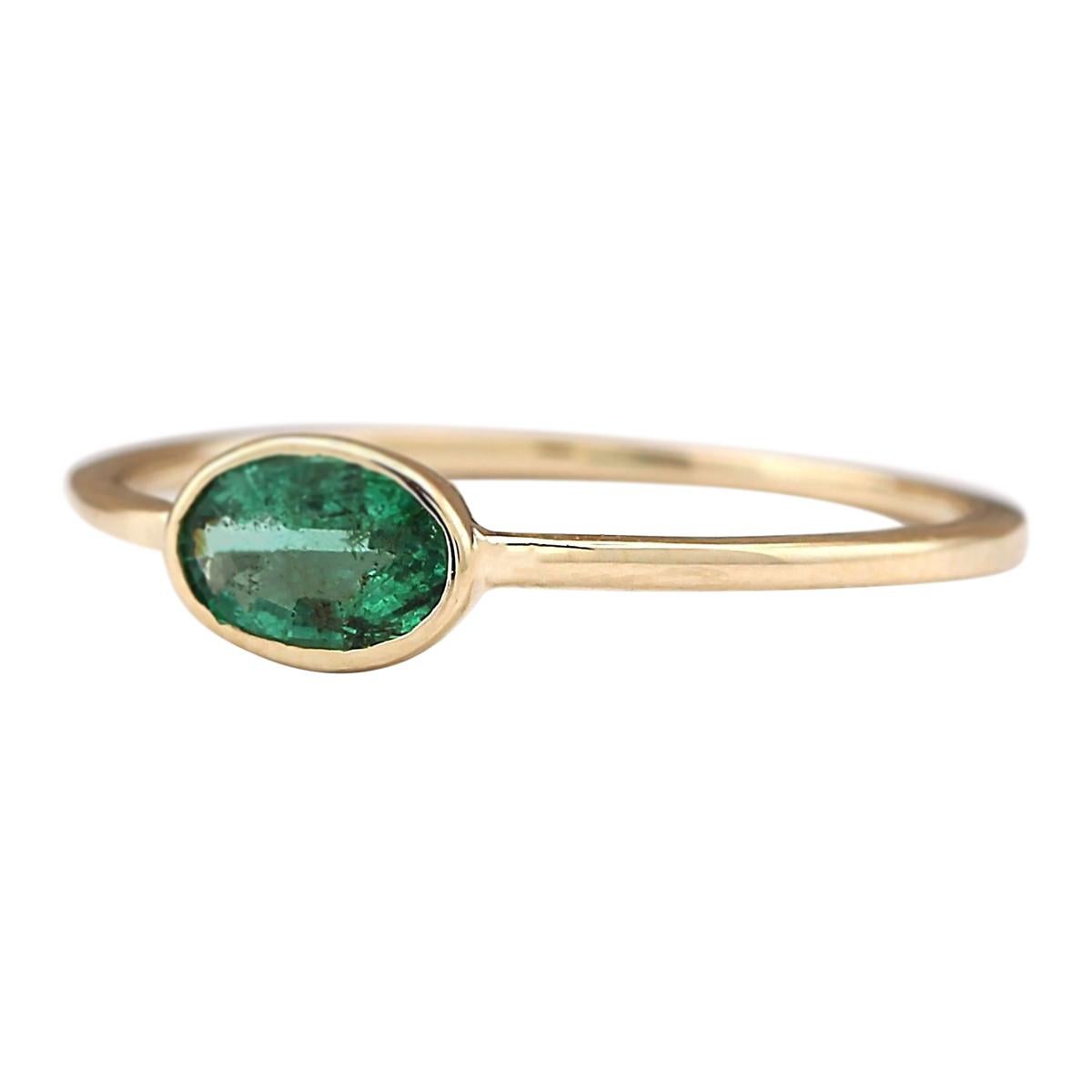 Introducing our exquisite 18 Karat Yellow Gold Ring featuring a captivating 0.50 Carat Natural Emerald gemstone. Stamped for authenticity, this ring weighs a mere 1.0 gram, ensuring both elegance and comfort. The Emerald gemstone, with its vibrant