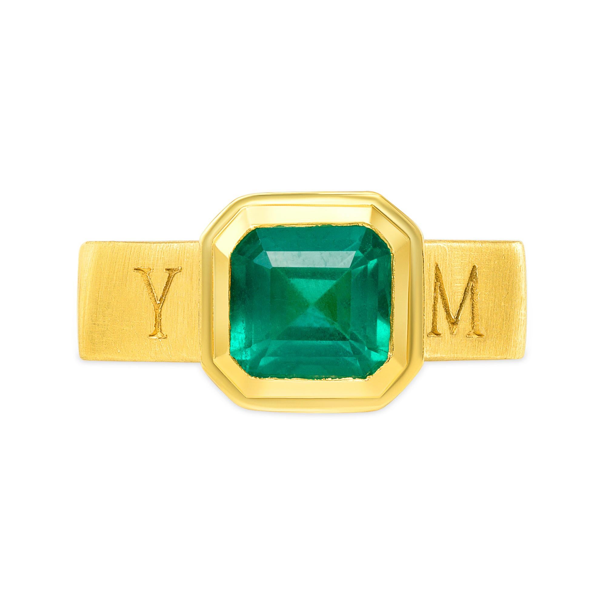 2.5 CARAT NATURAL EMERALD RING SET IN 18 KARAT GOLD

This exquisite medieval style ring features a 2.5 carat natural Zambian Emerald set in an Octagonal shaped band made of rich 18 karat yellow gold. Outer band engraved MERCURY - the Roman divine
