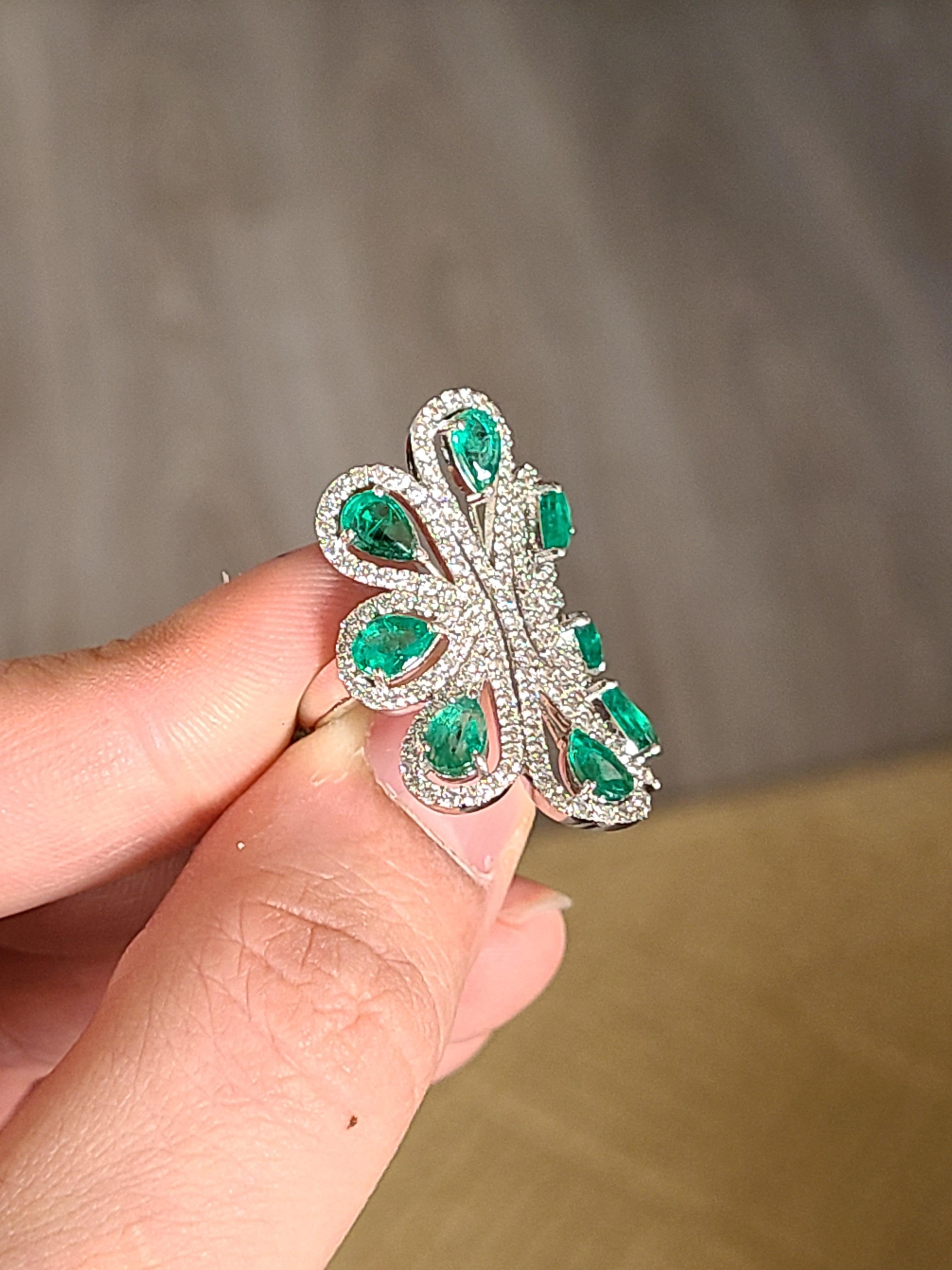 Modern Natural Emerald Ring Set in 18 Karat Gold with Diamonds