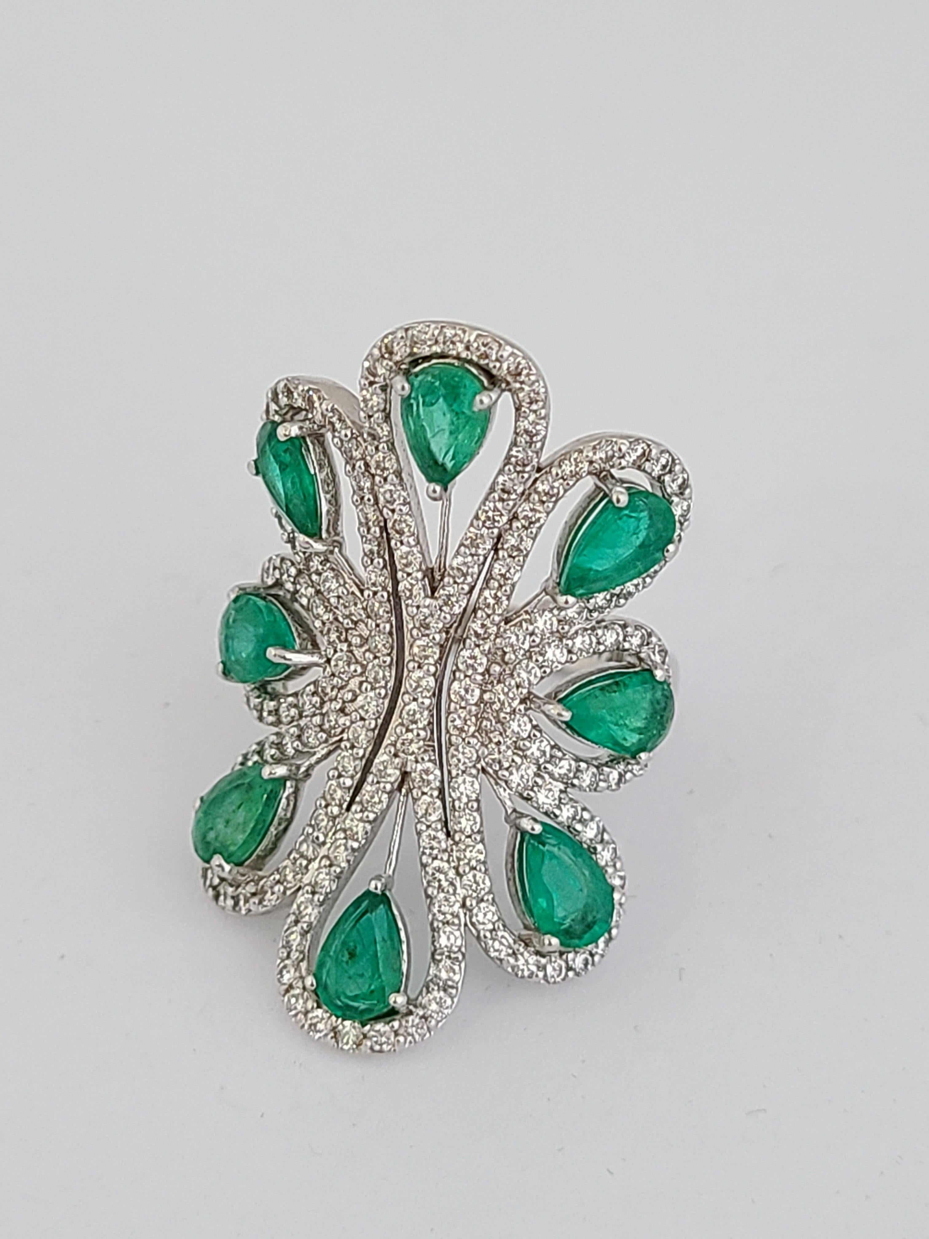 Pear Cut Natural Emerald Ring Set in 18 Karat Gold with Diamonds
