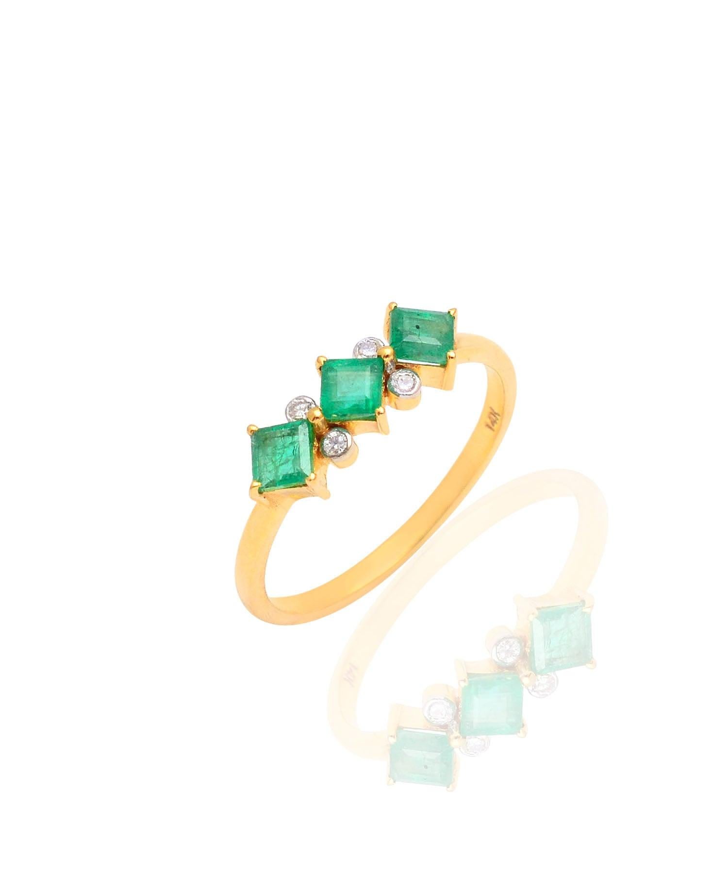This regal ring made with 14K solid yellow gold and bejeweled with natural diamond and emerald gemstones is the ideal present for your lady love. Powerfully delicate in its own right, the ring symbolizes growth and harmony because of its enchanting