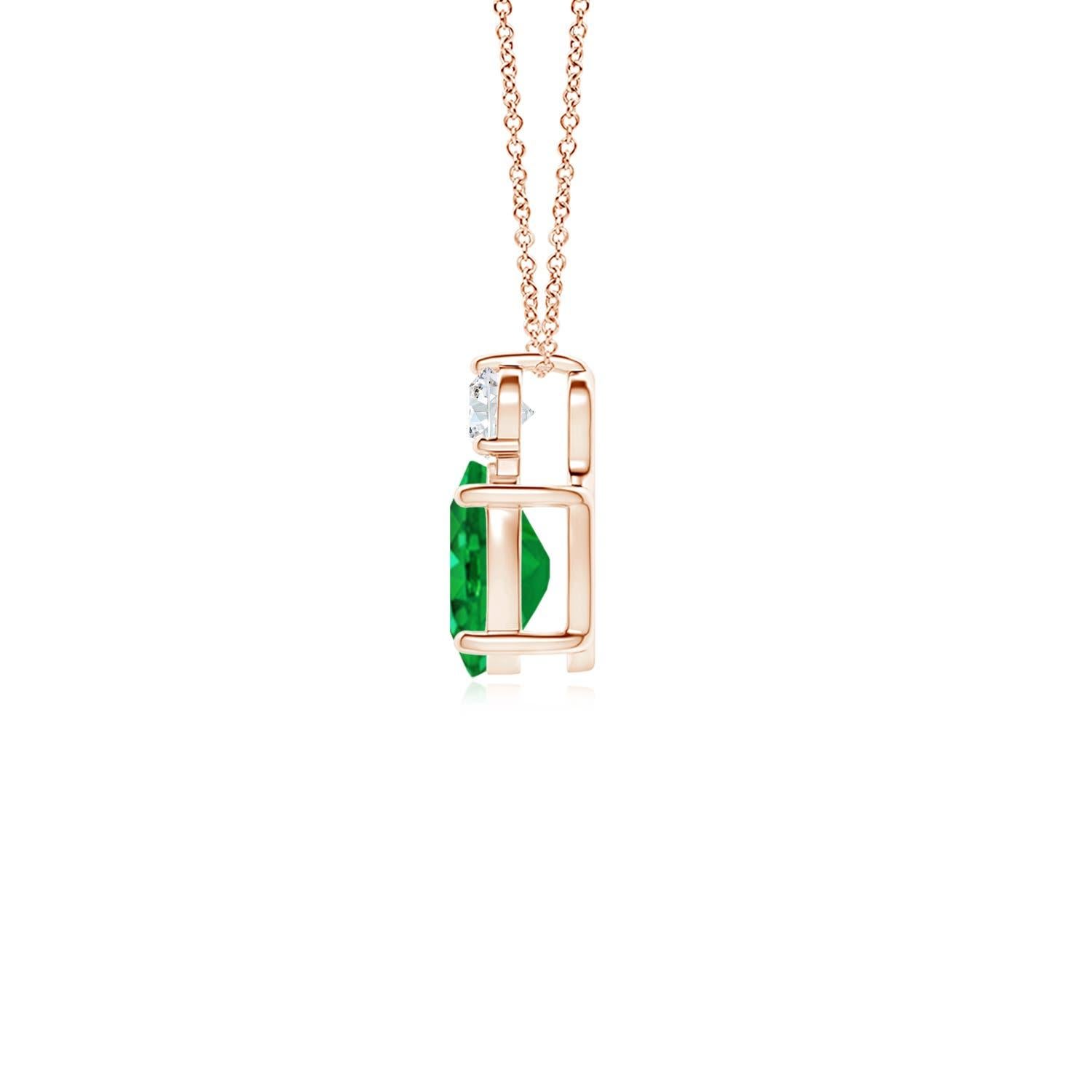 Crafted in 14k rose gold, this classic solitaire emerald pendant personifies elegance. The rich green oval emerald is topped by a sparkling diamond for added allure. The intricate scroll work on the sides enhances this prong set emerald pendant's