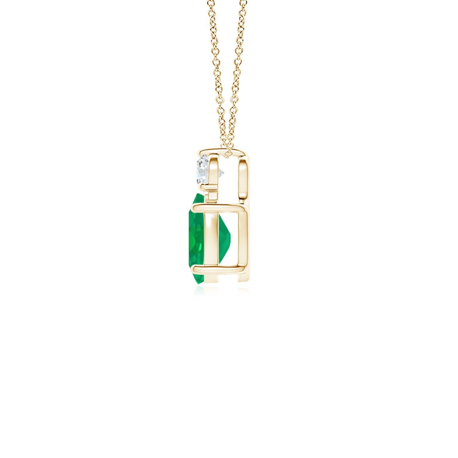 Crafted in 14k yellow gold, this classic solitaire emerald pendant personifies elegance. The rich green oval emerald is topped by a sparkling diamond for added allure. The intricate scroll work on the sides enhances this prong set emerald pendant's