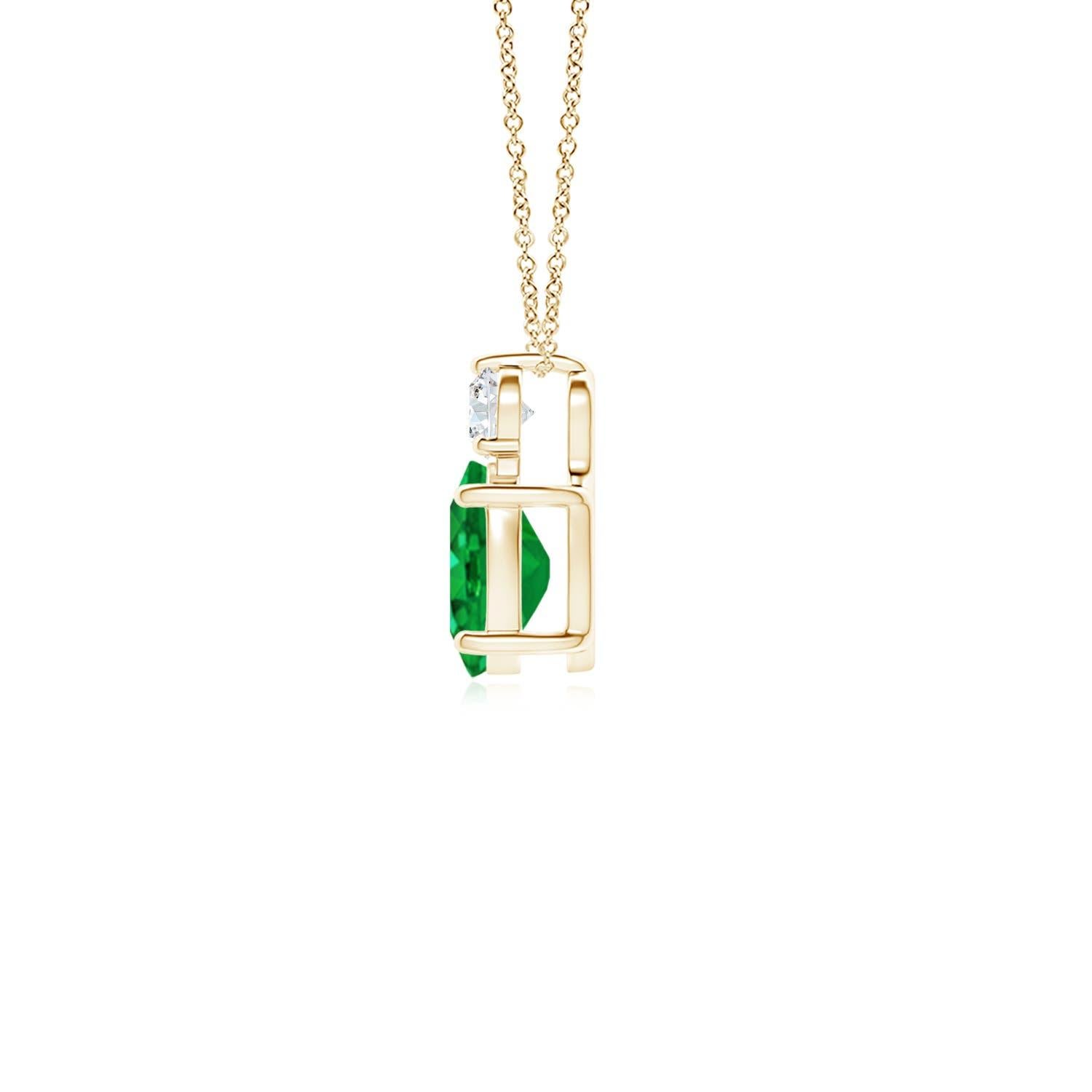 Crafted in 14k yellow gold, this classic solitaire emerald pendant personifies elegance. The rich green oval emerald is topped by a sparkling diamond for added allure. The intricate scroll work on the sides enhances this prong set emerald pendant's