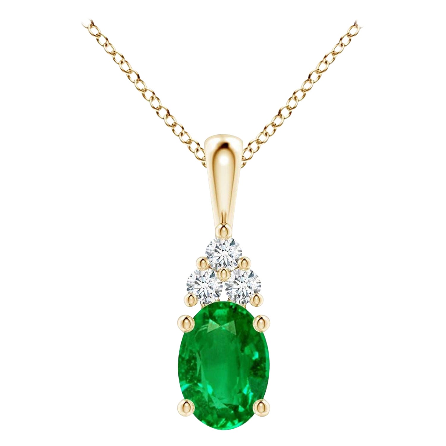 Ciondolo solitario con smeraldo naturale e diamante in oro giallo Dimensioni 7x5 mm in vendita