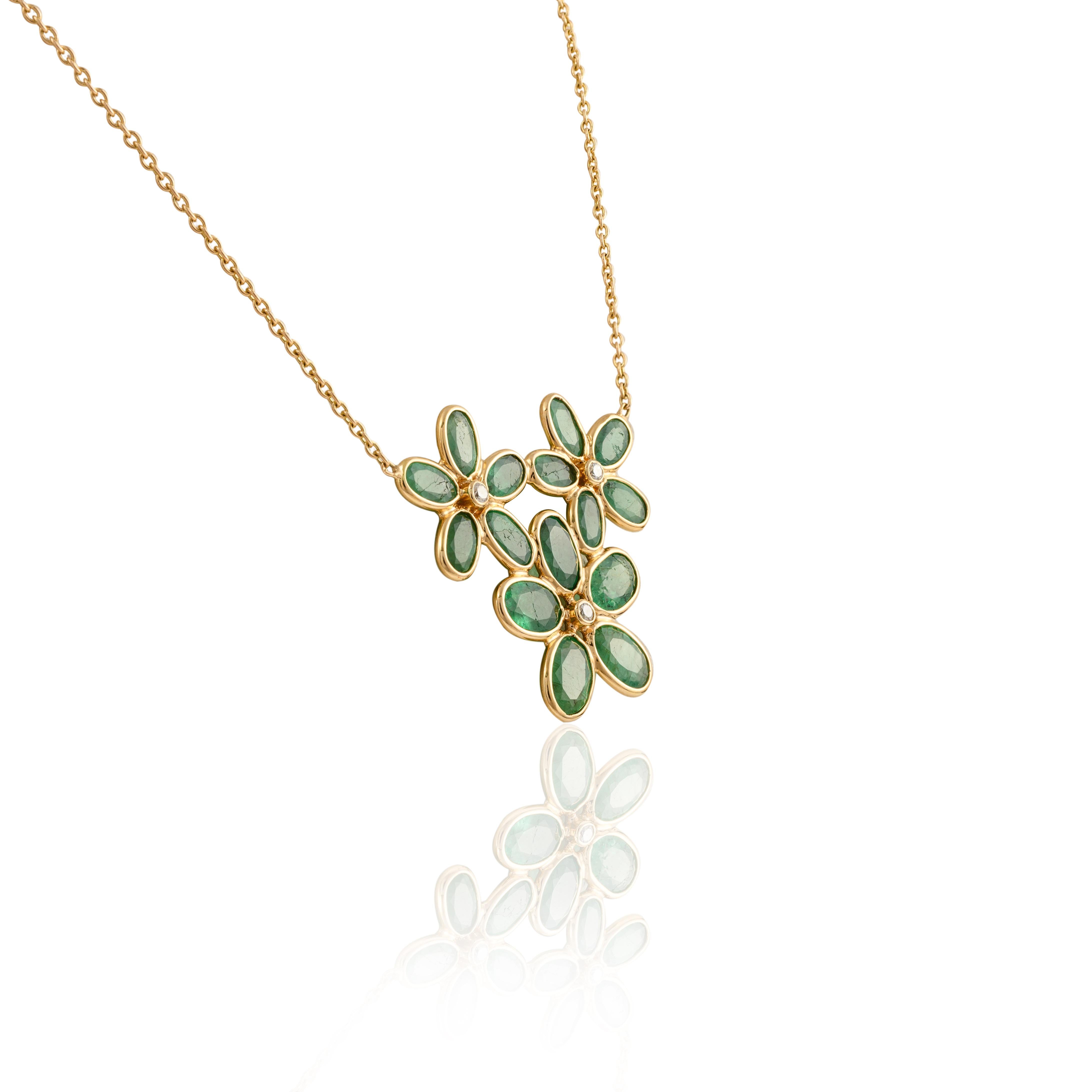 Natural Emerald Flower Necklace with Diamond in 18K Gold studded with oval cut emerald. This stunning piece of jewelry instantly elevates a casual look or dressy outfit. 
Emerald enhances the intellectual capacity. 
Designed with a oval cut emerald