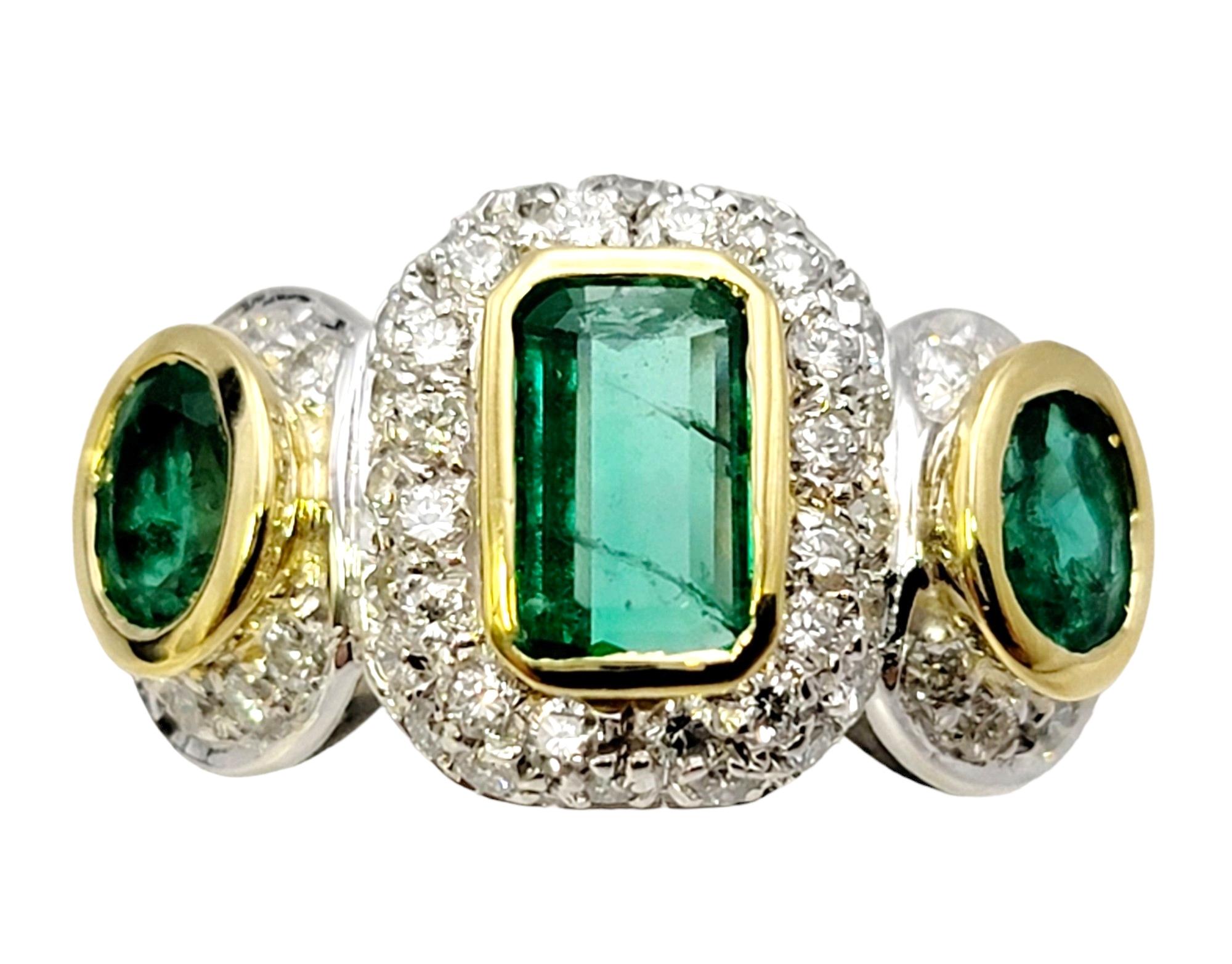Ring size: 7

Bright and beautiful emerald three-stone ring with shimmering pave diamonds. Crafted in lustrous two-tone 18 karat gold, this ring showcases a captivating display of vibrant gemstones and dazzling diamonds, creating a truly mesmerizing