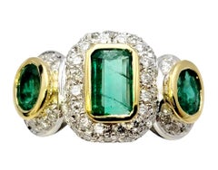 Natural Emerald Three Stone Ring with Pavé Diamond Halo in Two-Tone 18K Gold