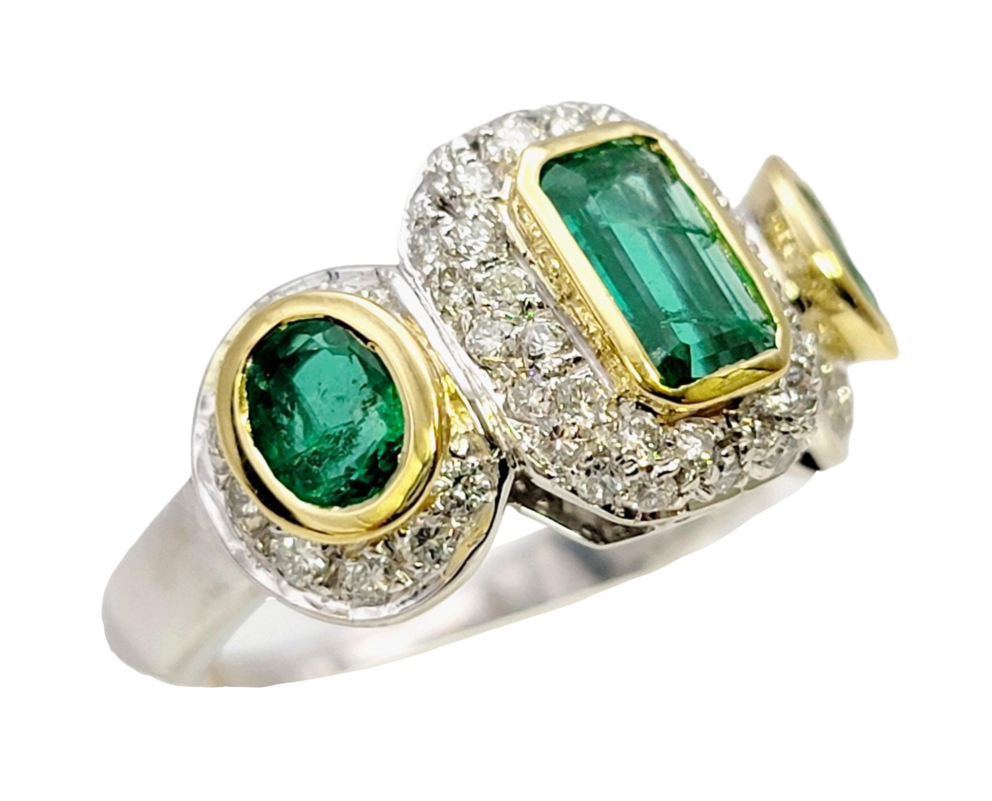 Contemporary Natural Emerald Three Stone Ring with Pave Diamond Halos in 18 Karat Gold For Sale