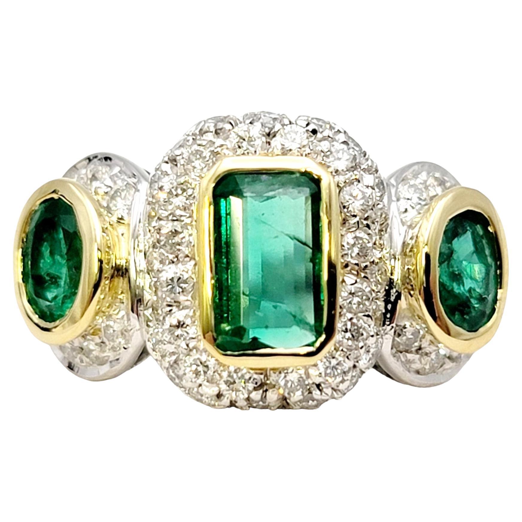 Natural Emerald Three Stone Ring with Pave Diamond Halos in 18 Karat Gold For Sale