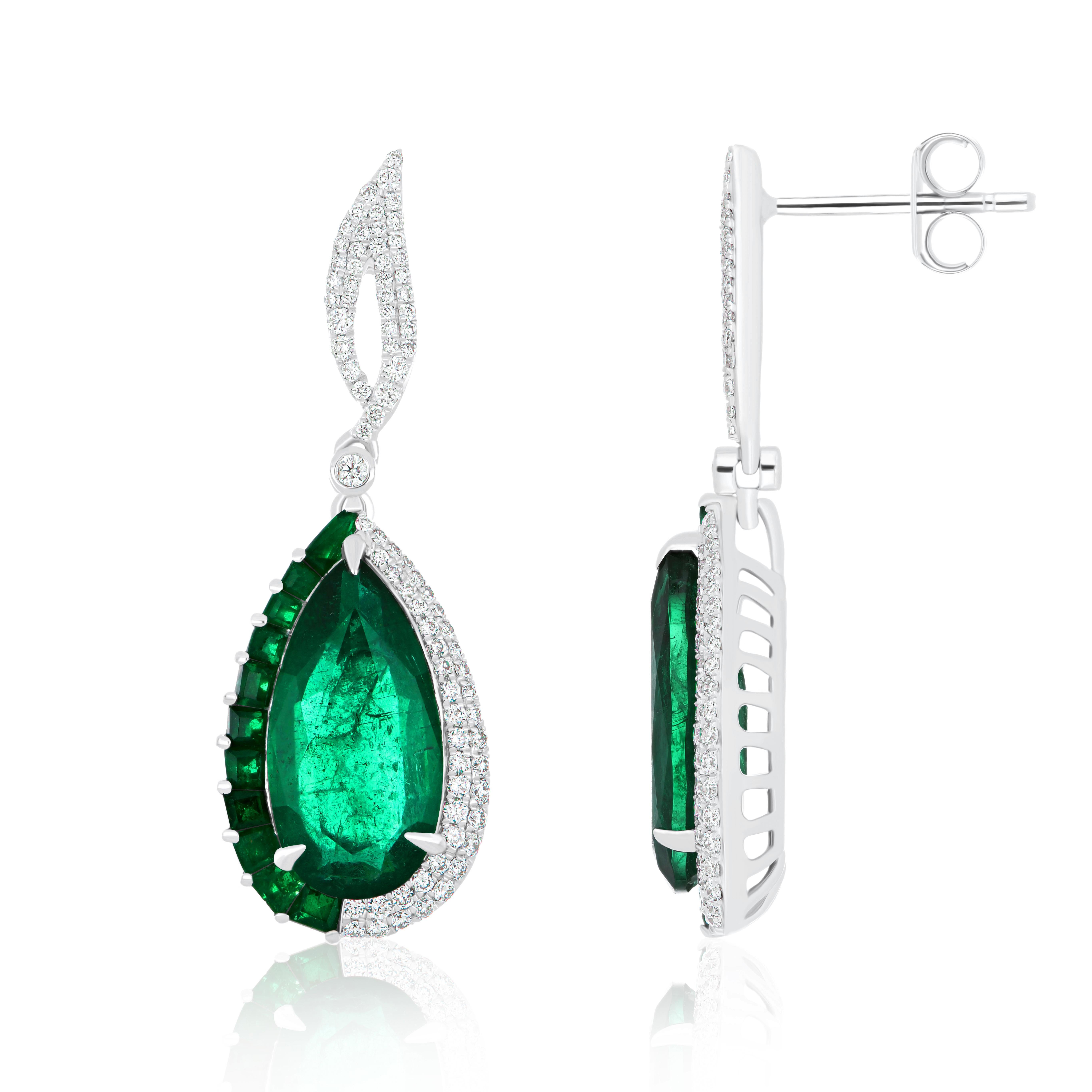 Elegant and Exquisitely detailed White Gold earrings, with 8.80CT's (total approx.) Emerald Pear Shape, accented with micro pave Diamonds, weighing approx.  0.64 CT's. (total approx.). total carat weight. Beautifully Hand-Crafted Earring in 18 Karat