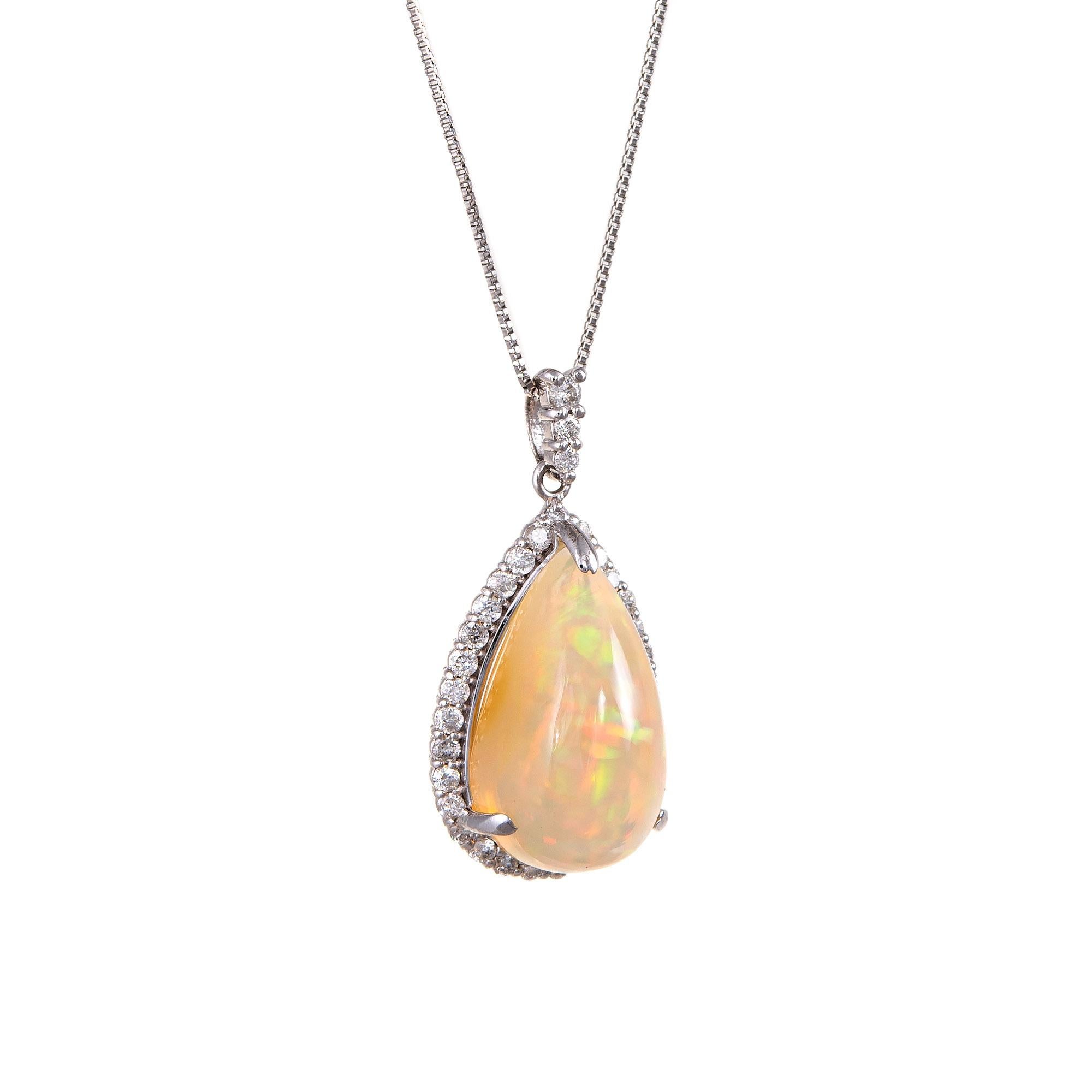 Finely detailed natural Ethiopian fire opal & diamond pendant & necklace crafted in 850 & 900 platinum. 

Natural opal measures 16mm x 9mm (estimated at 4.55 carats), accented with an estimated 0.32 carats of diamonds. The diamonds are estimated at