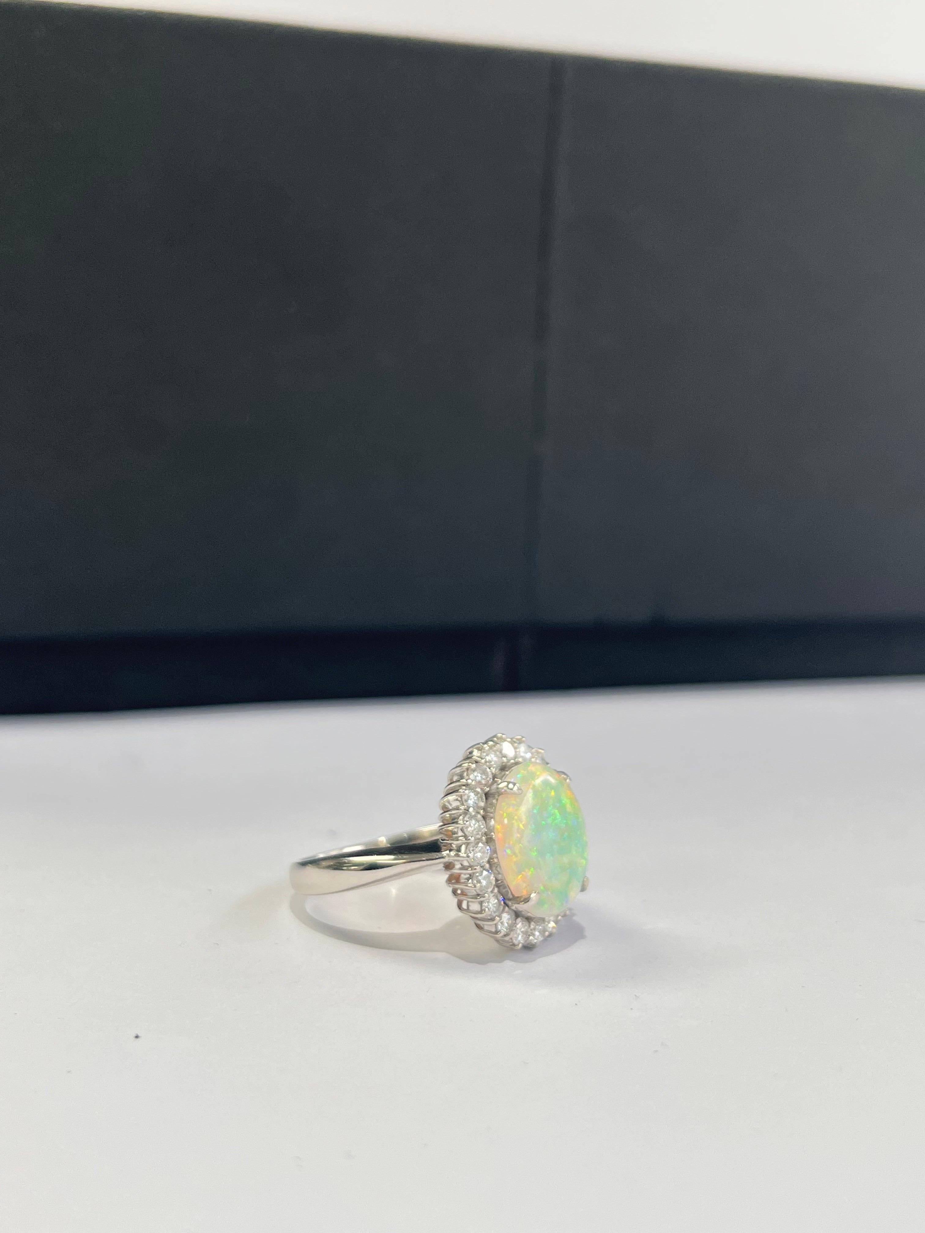 A very beautiful and wearable Opal Engagement Ring set in Platinum 900 and Diamonds. The weight of the Opal is 2.51 carats. The Opal is of Australian origin. The weight of the Diamonds is 0.71 carats. Net Platinum weight is 7.756 grams. The