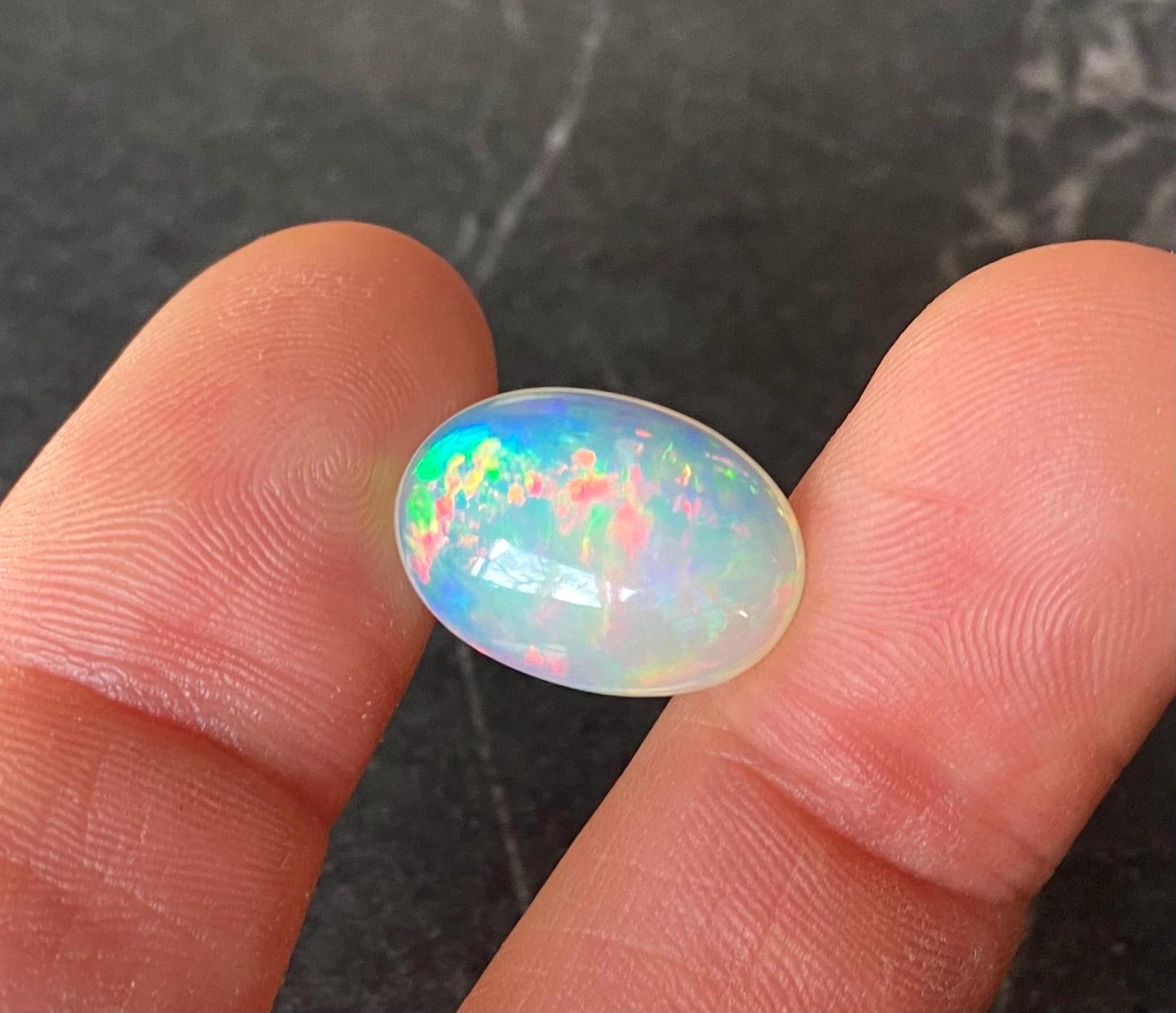 Natural Ethiopian Opal Loose gemstone 9.45ct. Oval cabochon, 17.76x14.02x7.04 mm For Sale 4