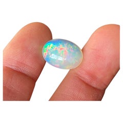 Natural Ethiopian Opal Loose gemstone 9.45ct. Oval cabochon, 17.76x14.02x7.04 mm