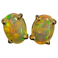 Natural Ethiopian Opal Solitaire Stud Earrings in Solid 14k Gold Oval 9x7mm