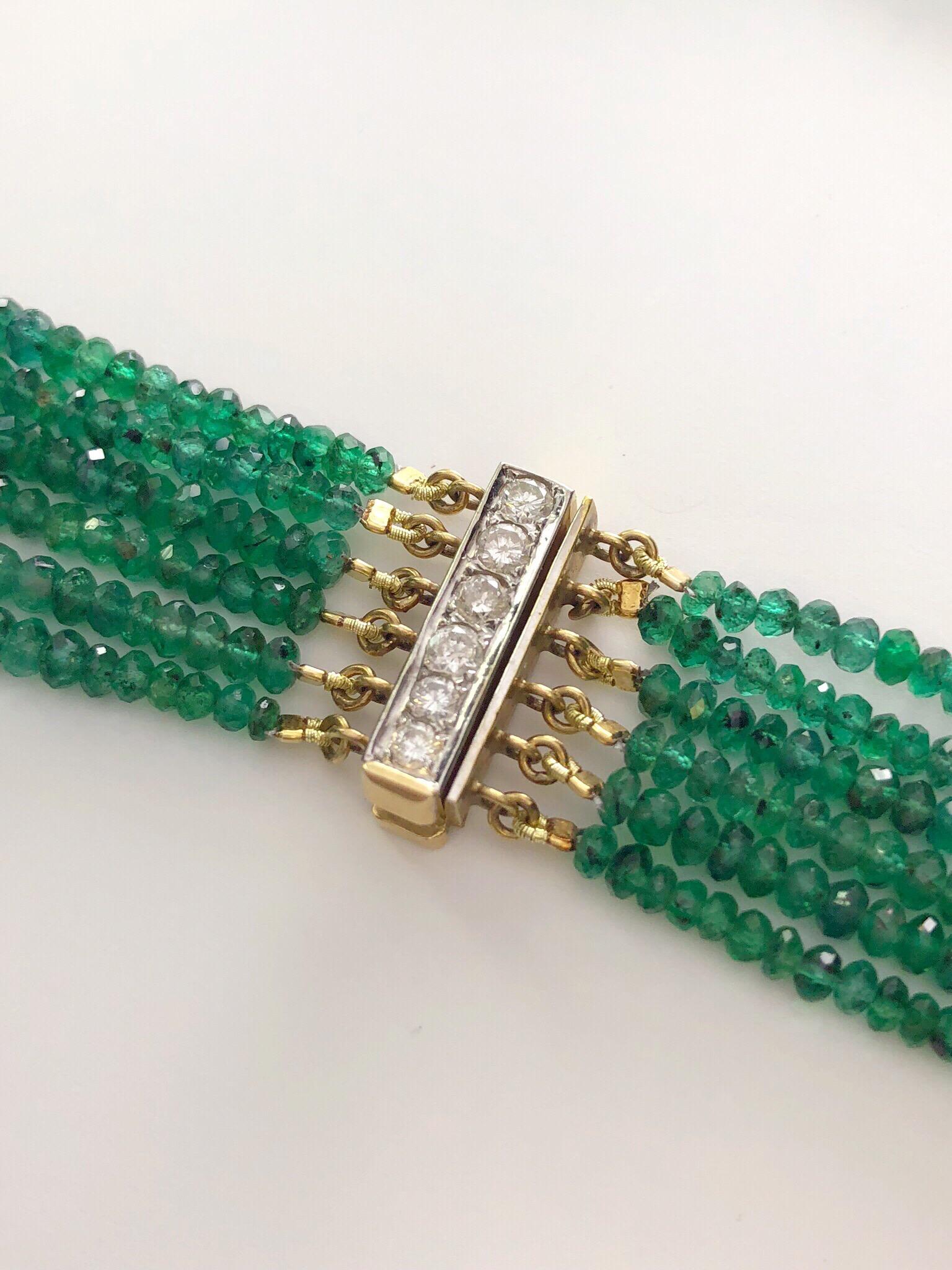 302 carats of graduating emerald beads glisten in this beautiful multi-strand bib necklace. The six strands of emeralds are held together by an 18 karat gold and round brilliant diamond clasp.
The beads graduate from 2.5 mm x 5 mm and the nesting