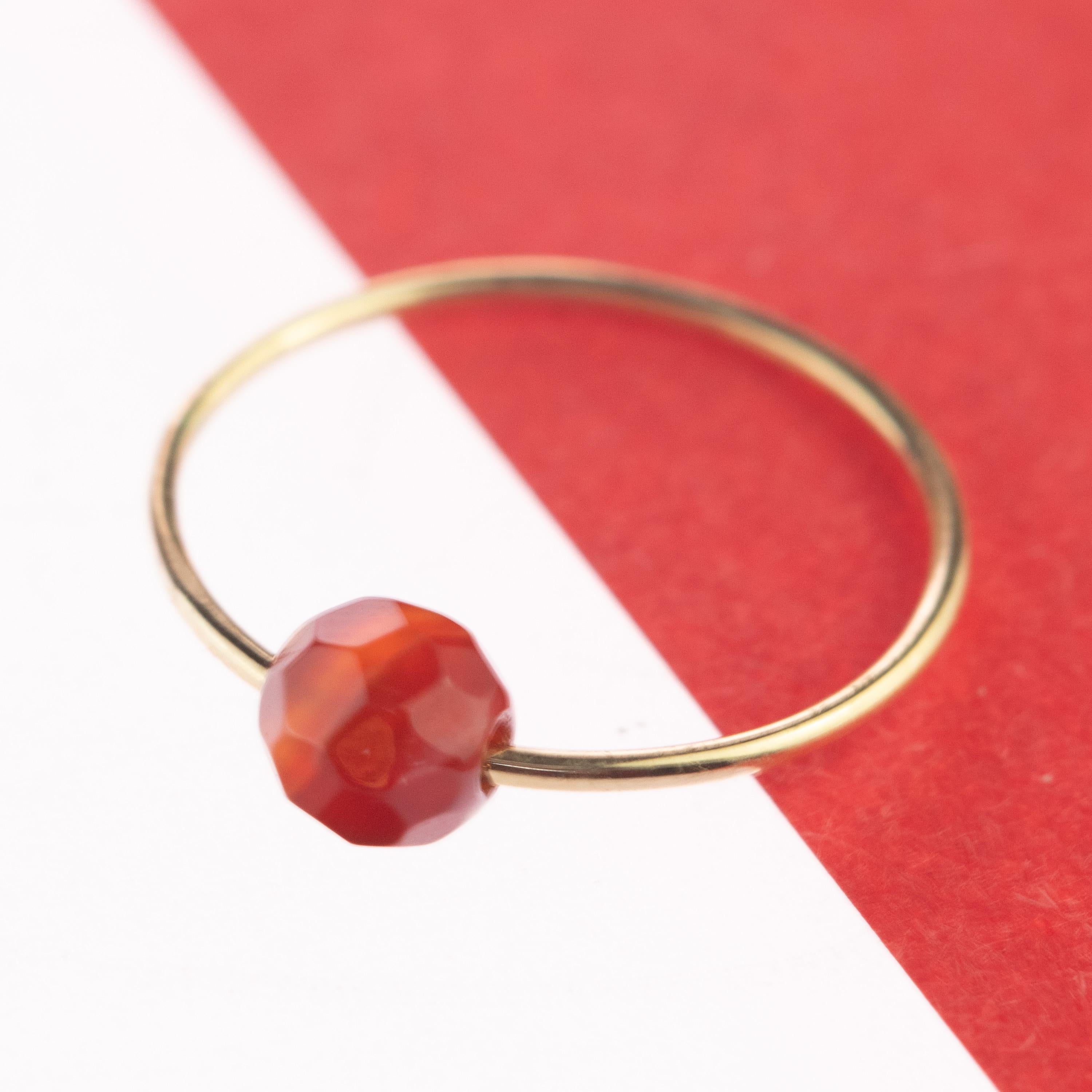 Signature INTINI Jewels Mars Planet ring. Contemporary ring design in 18 karat yellow gold with a precious Faceted Garnet rondelle.  Design and color mixed in one jewel. Delight yourself with a strong, minimalist design, just for a stunning chic