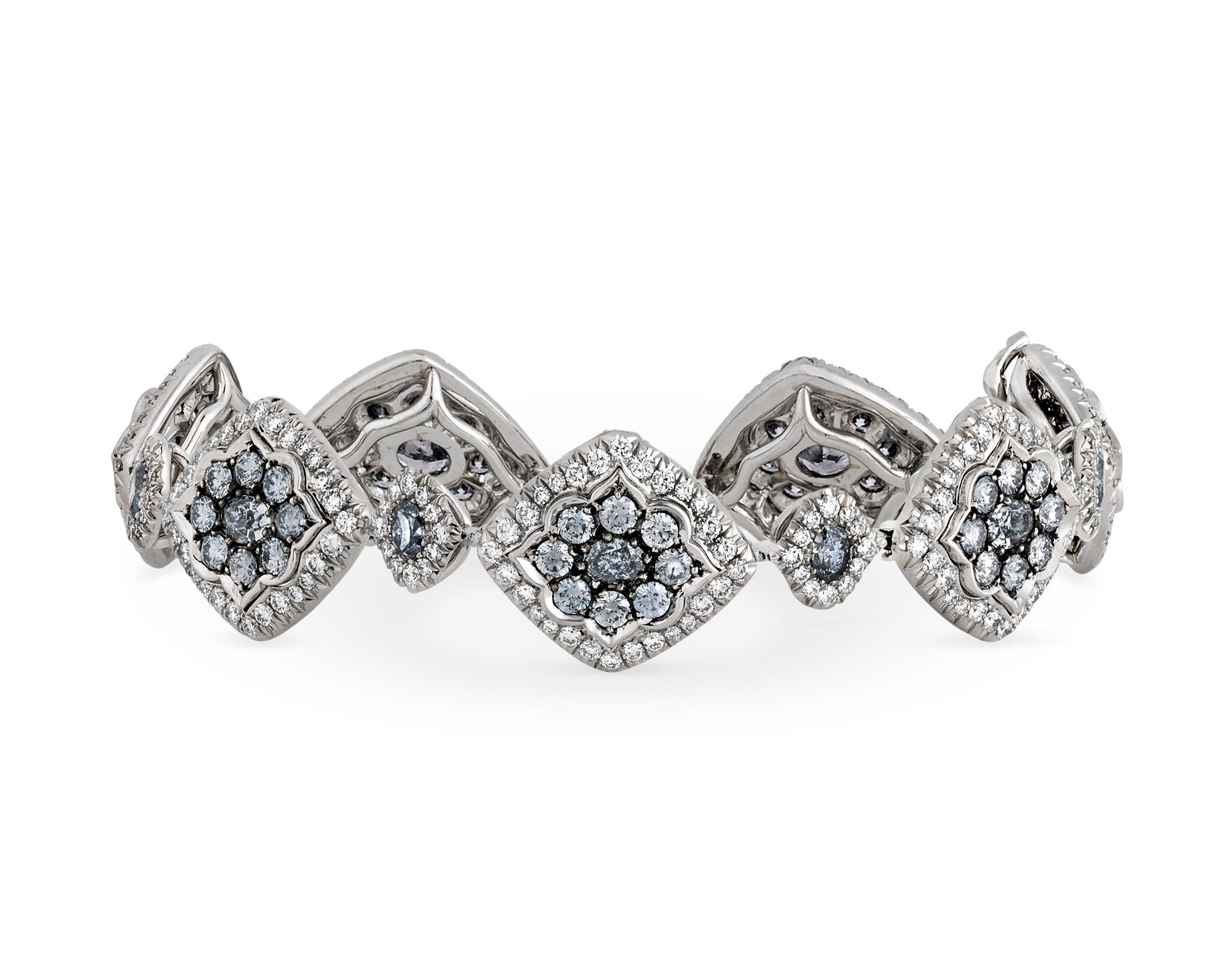 Fourteen exceptionally rare Argyle blue diamonds are featured in this one-of-a-kind bracelet. The highly desirable oval-cut gemstones total 1.85 carats, and each displays the highly unique blue color for which Argyle blue diamonds are renowned. The