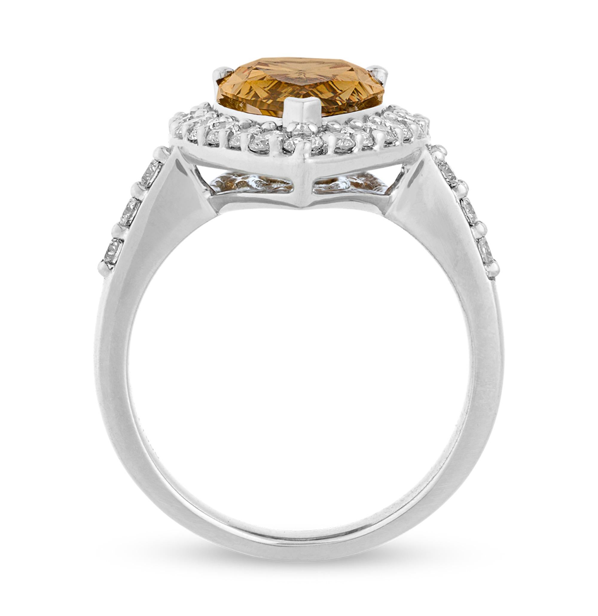 The exceptionally rare 4.00-carat fancy deep brown yellow diamond in this eye-catching ring possesses a chocolatey, yet fiery coloration that truly sets it apart. The perfect marriage of brown and yellow hues, this pear-shaped, brilliant cut stone