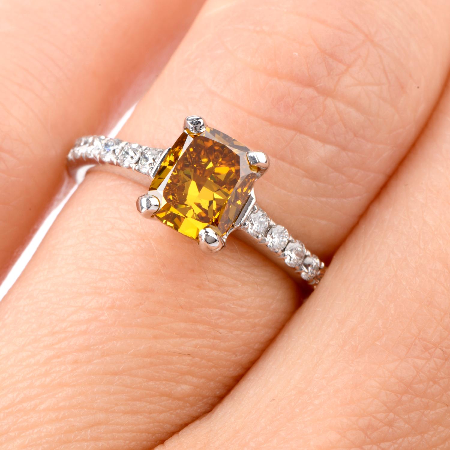 Not an Engagment Ring like all others!  This stunning ring features a GIA Certified 1.60 carat cushion shaped natural Fancy Deep Orage-Yellow SI1 clarity Diamond in the center and bright white diamonds on either side and down the shoulders.  These