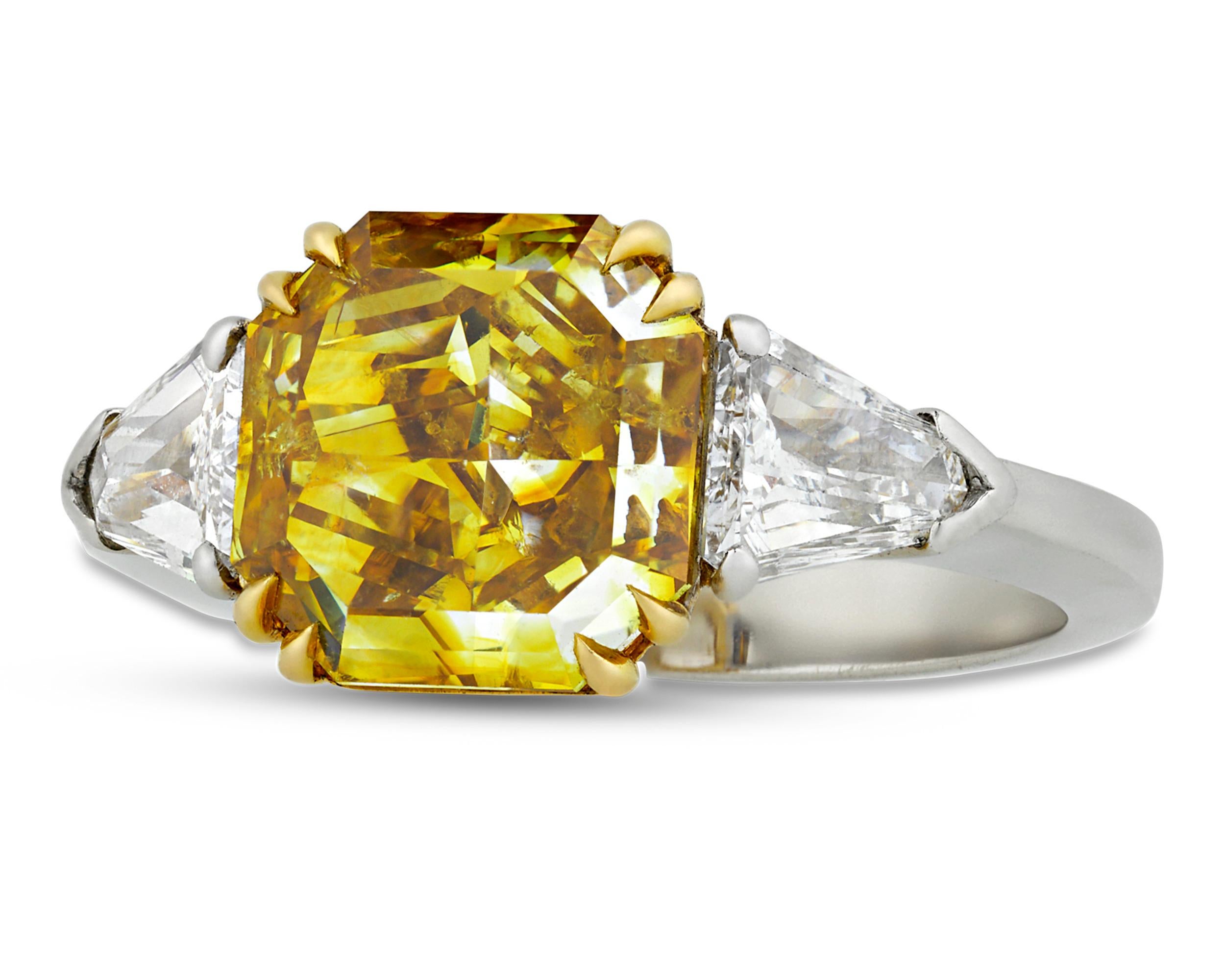 A rare 4.01-carat fancy deep yellow diamond displays a remarkable depth of color and brilliance in this extraordinary ring. Prized for both their beauty and rarity, yellow diamonds of this quality are among the most desirable and radiant of colored