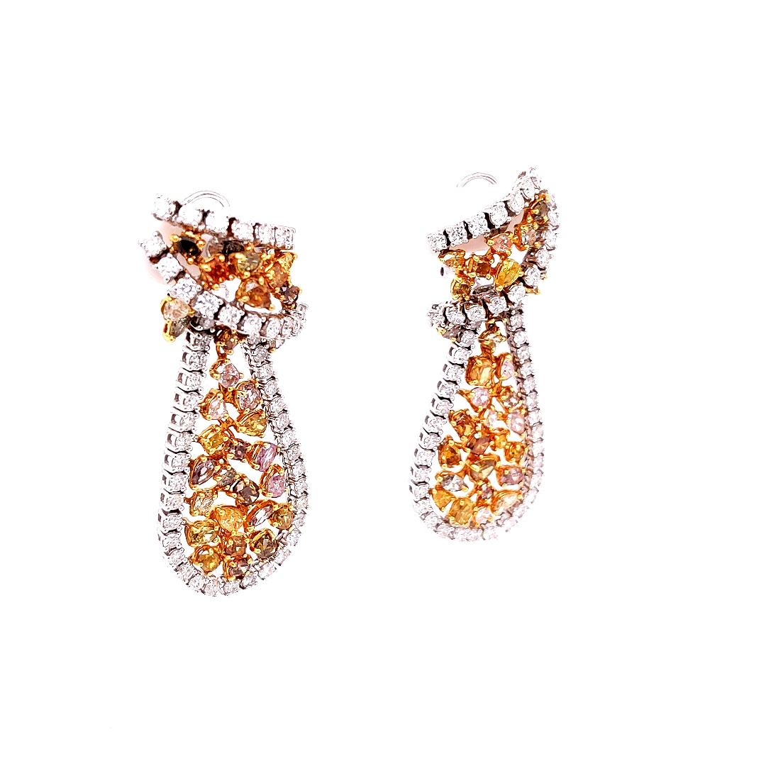 These Unique Natural Fancy Diamonds drop earrings illuminates with 100 white diamonds surrounding 62  natural fancy colored diamonds (yellows, pinks, greens, browns), creating a stunning contrast of a very modern style inspired by the vivid