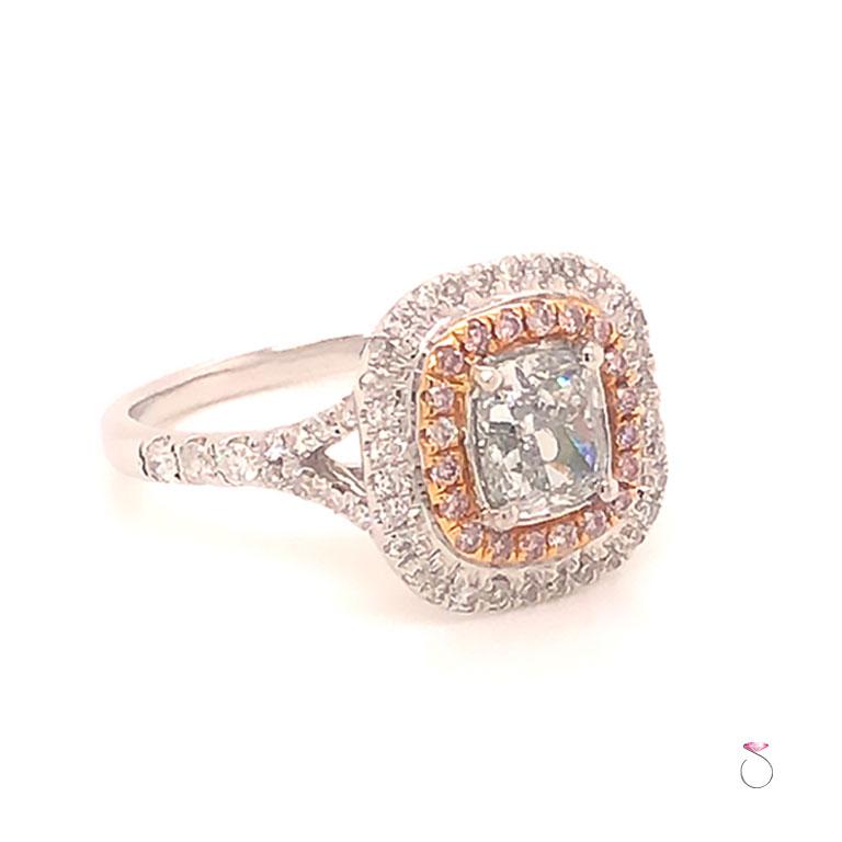 Stunning green Diamond ring with pink and white diamond double halo. This magnificent ring features a 1.01 carat cushion shape natural light green Diamond in the center surrounded by a natural pink diamond halo and a white diamond second halo. The
