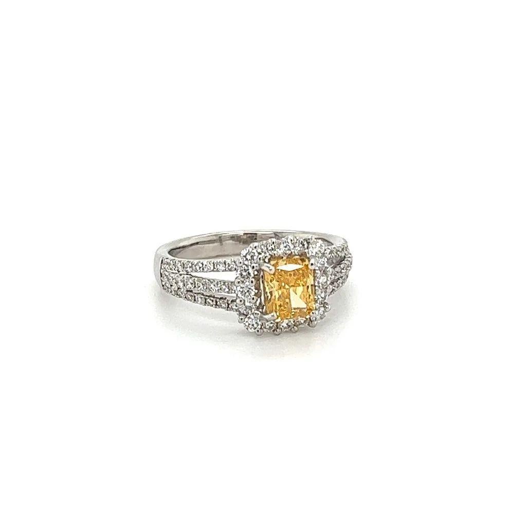Simply Beautiful! Finely detailed Natural Fancy Intense Yellow-Orange Radiant Diamond GIA and Diamond Gold Cocktail Ring. Centering a securely nestled Hand set Radiant Diamond, weighing approx. 0.71 Carat. GIA lab report # 6217508623. Surrounded by