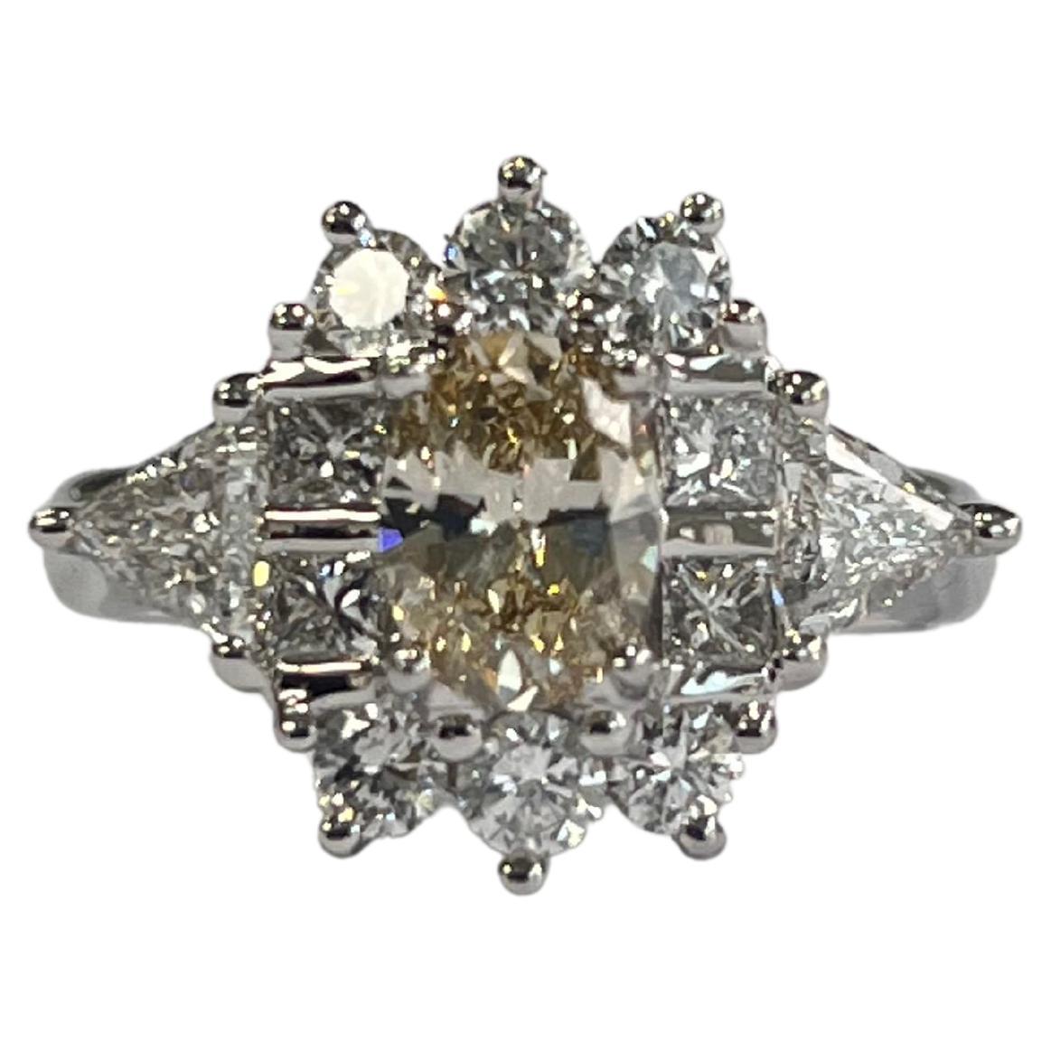 A very gorgeous and wearable Diamond Engagement Ring set in Platinum 900. The weight of the centre Fancy Light Brownish Yellow Diamond is 0.79 carats. Other Diamonds weight is 1.22 carats. Net Platinum weight is 8.50 grams. The dimensions of the