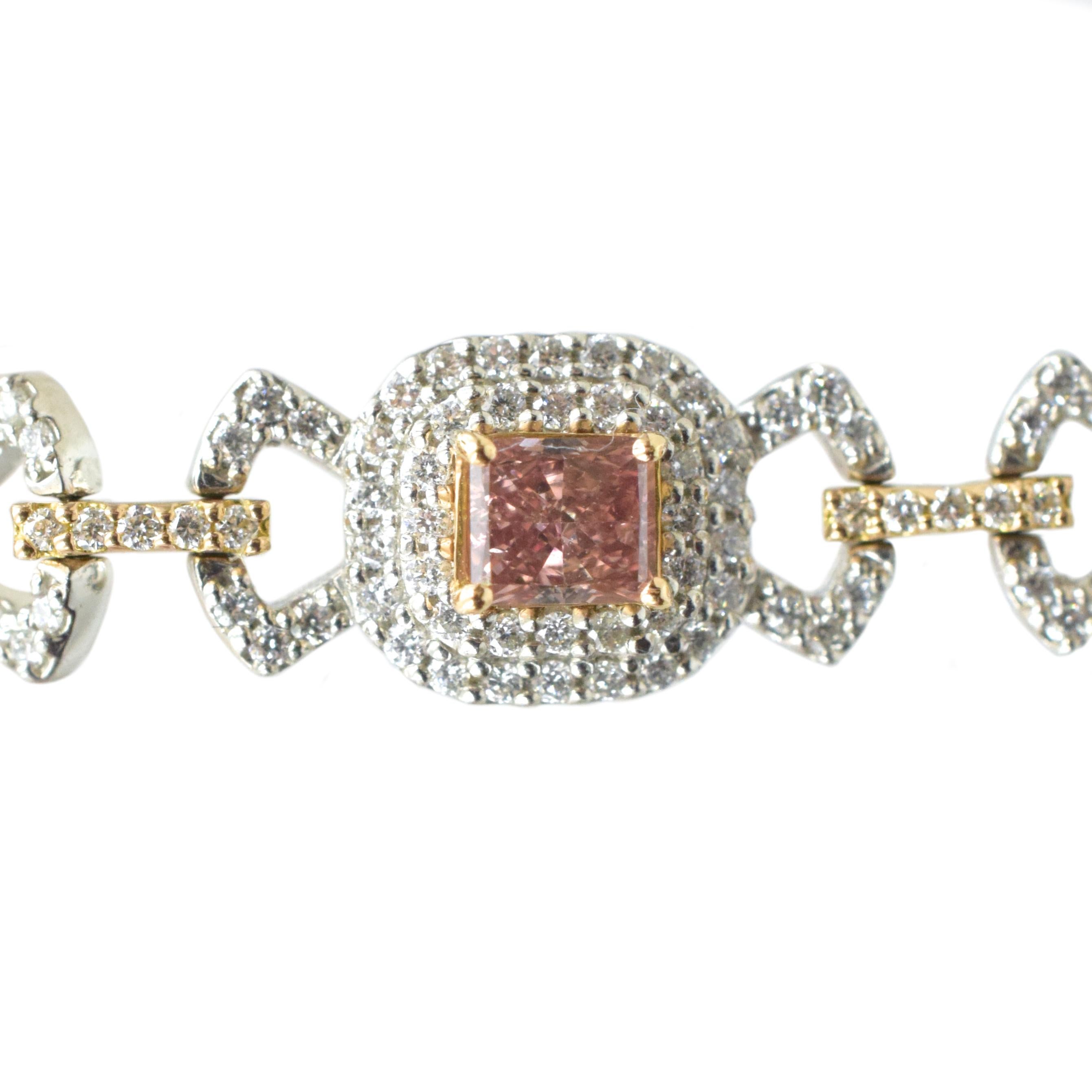 Fancy Pink  and White Diamond Bracelet.
Set with eight pink color cut-cornered rectangular, square, and cushion modified brilliant-cut fancy intense pink, fancy intense orangy pink, fancy orangy pink diamonds weighing 2.57ct in total.
 Accented by