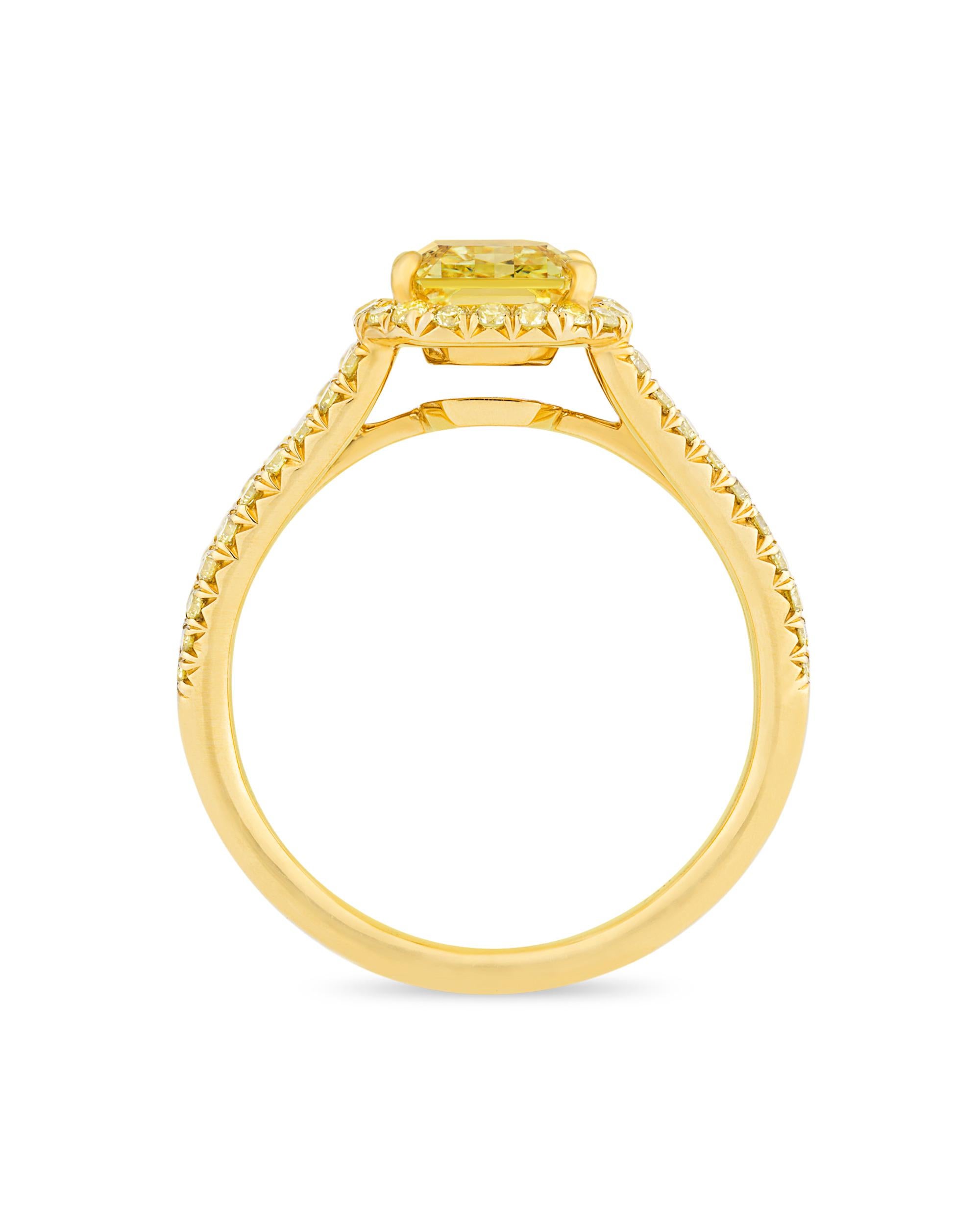 The rarity and brilliance of a fancy vivid yellow diamond are seldom matched in the realm of precious gemstones. The absolutely dazzling 2.02-carat fancy vivid yellow diamond in this ring is a spectacular example of these highly coveted stones. The