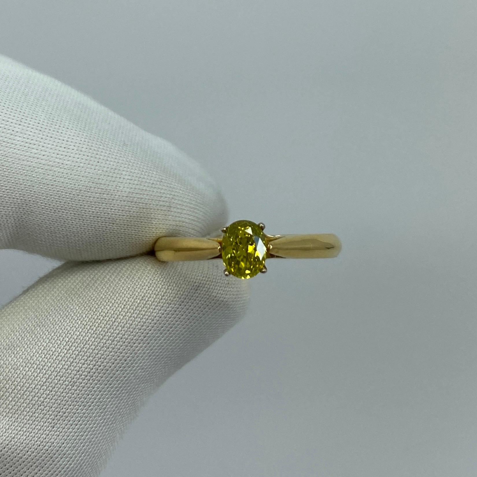 Fine Natural Fancy Yellowish Green Diamond 18k Gold Solitaire Ring. 

0.51 carat stone with a vivid fancy yellowish green colour and excellent VVS1 clarity. Very clean stone.

Yellow gold band with white gold claws to really show the stone to best