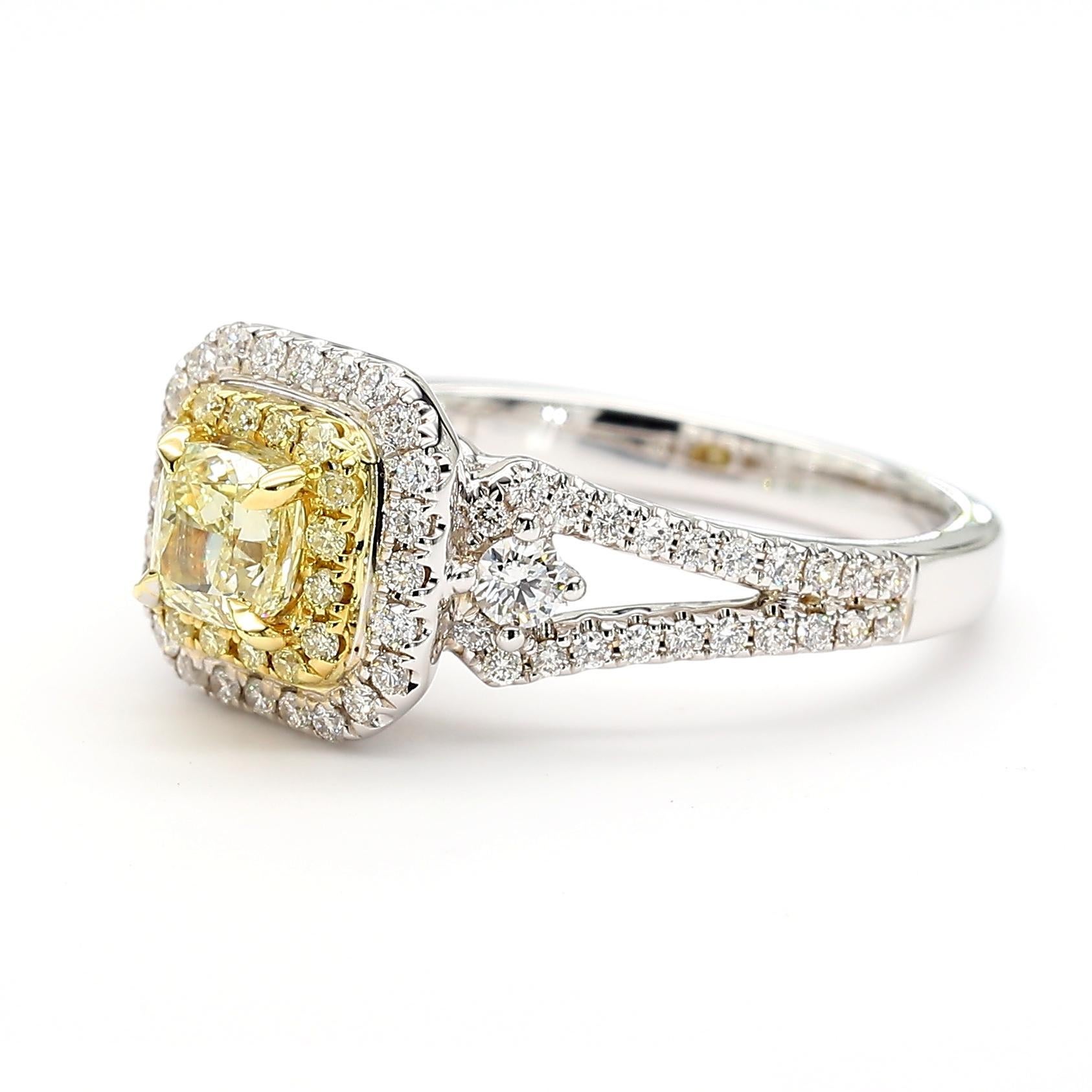 RareGemWorld's beautiful diamond ring. Mounted in a beautiful 18K Yellow and White Gold setting with a natural cushion cut yellow diamond. The yellow diamond is surrounded by round natural yellow diamond melee and round natural white diamond melee.