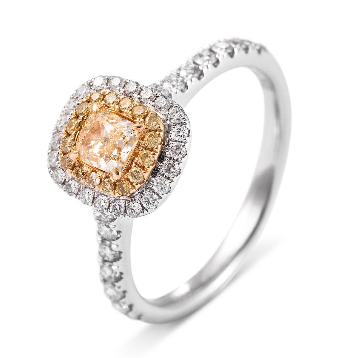 Natural Fancy yellow Diamond surrounded by a double halo of white and yellow diamonds making up a total of 0.70 carats. Expertly crafted using 18 Karat white gold. 
The Yellow Diamonds in fact take the credit for making fancy diamonds very popular