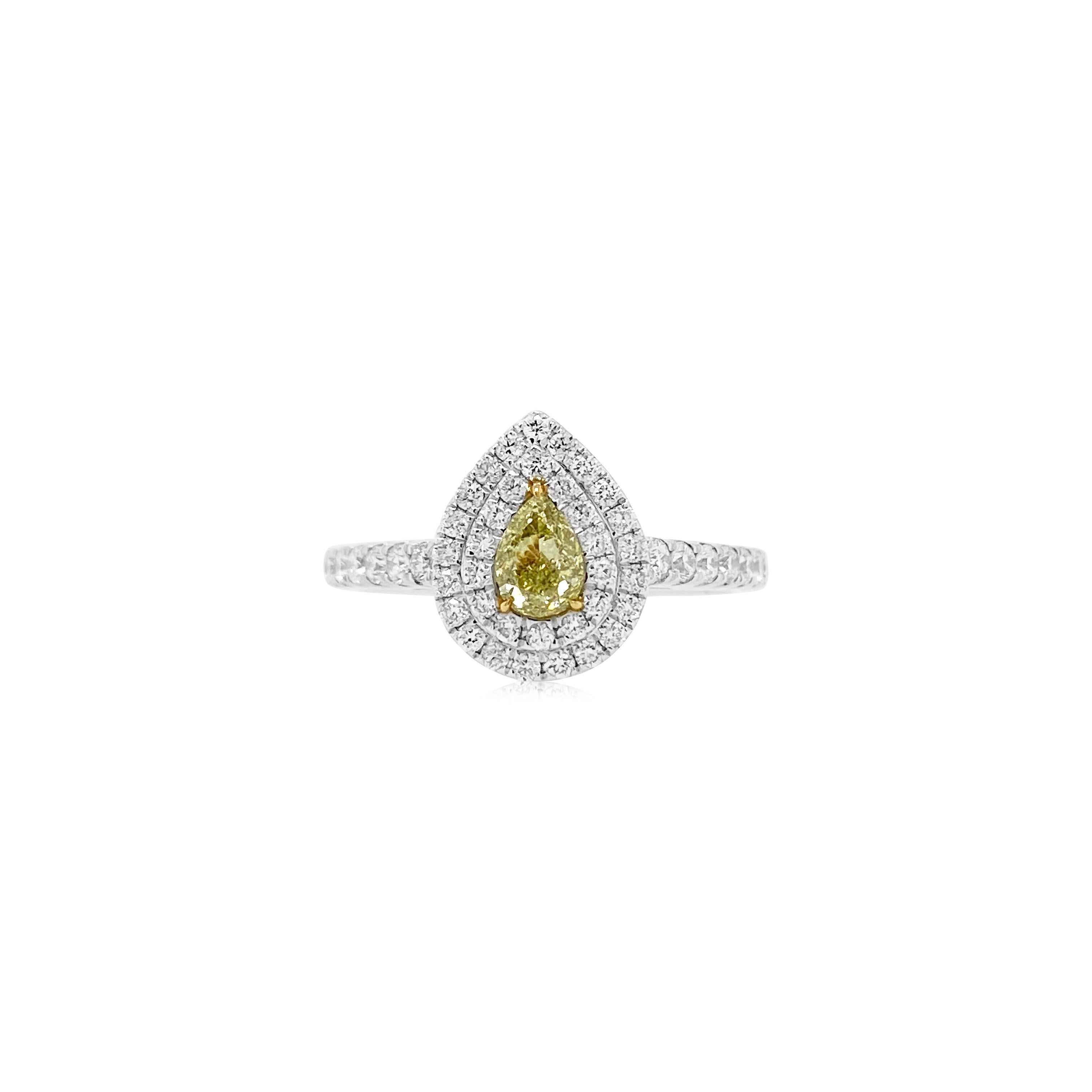 This classic Fancy Yellow Diamond and White diamond Pear shape Engagement Ring is a beautiful rendition of modern yet classic cut design and natural rare color diamonds.


-	Centre Diamond is CGL Lab Certified Fancy Yellow diamond – 0.301 ct
-	Round