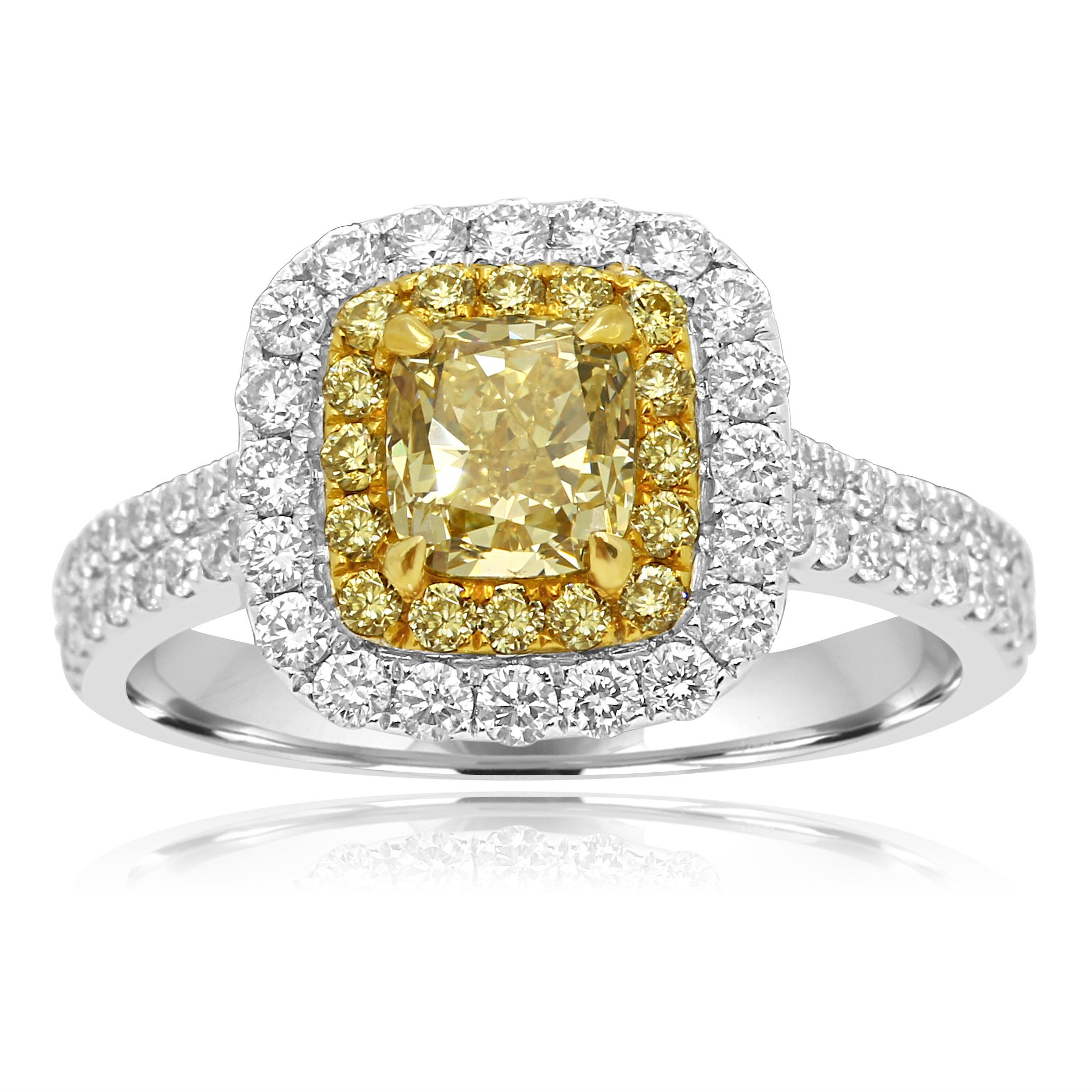 Natural Fancy yellow Diamond Cushion 1.01 Carat Encircled in Double Halo of Natural Fancy Yellow Round Diamonds 0.20 Carat and White Round Diamonds 0.68 Carat in Stunning and Classic 18K White and Yellow Gold Bridal Or Fashion Ring.

Style available