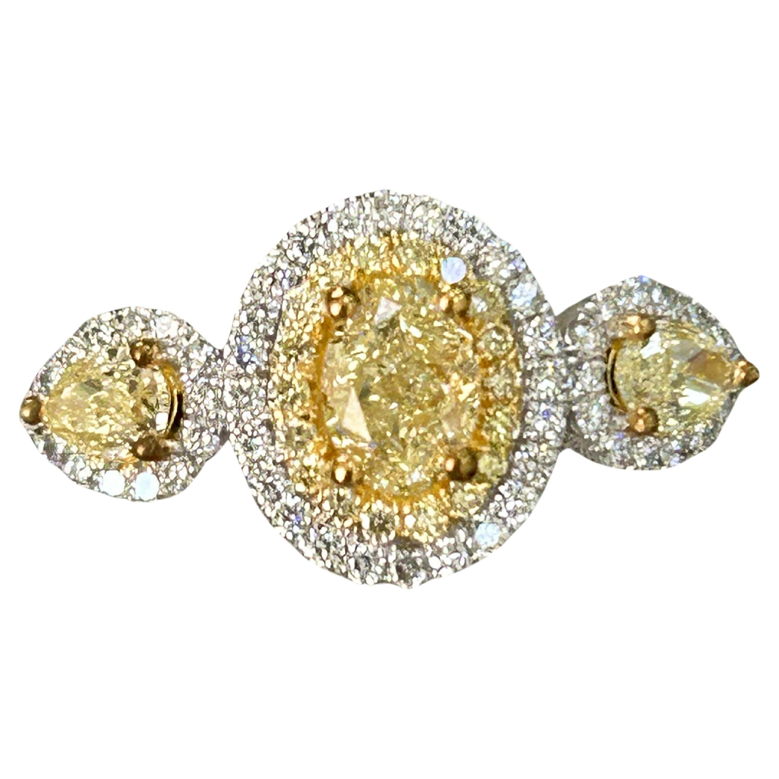 Natural Fancy Yellow Diamond Oval 3 Stone ring For Sale