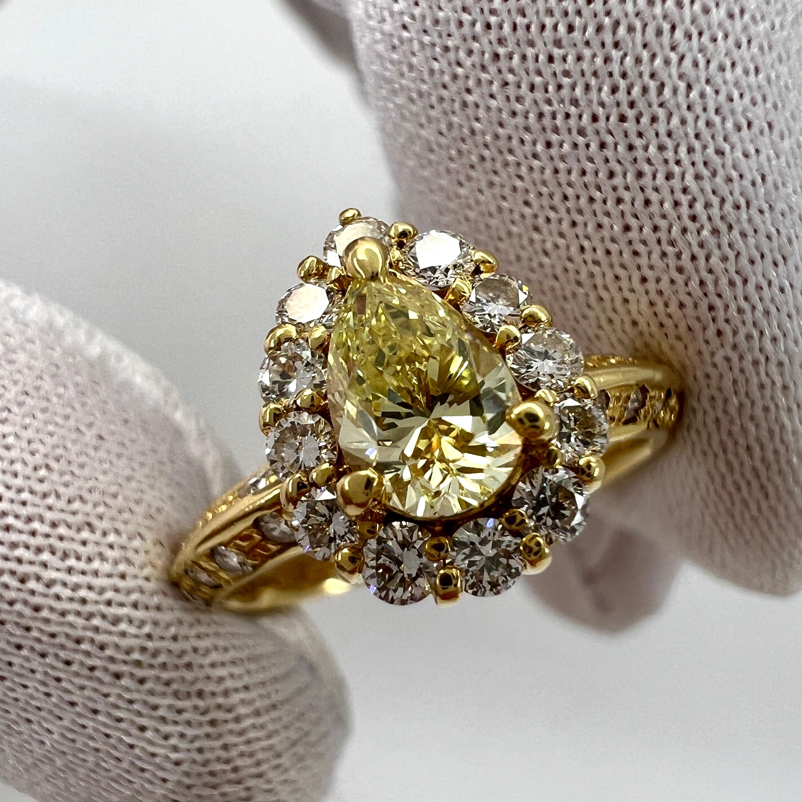 Natural Fancy Yellow Pear Cut Diamond 18k Yellow Gold Cocktail Cluster Ring.

Stunning 0.98 Total carat fancy yellow untreated diamond set in a beautiful 18k yellow gold ring. 
Centre stone is a 0.48ct natural fancy yellow diamond with an excellent