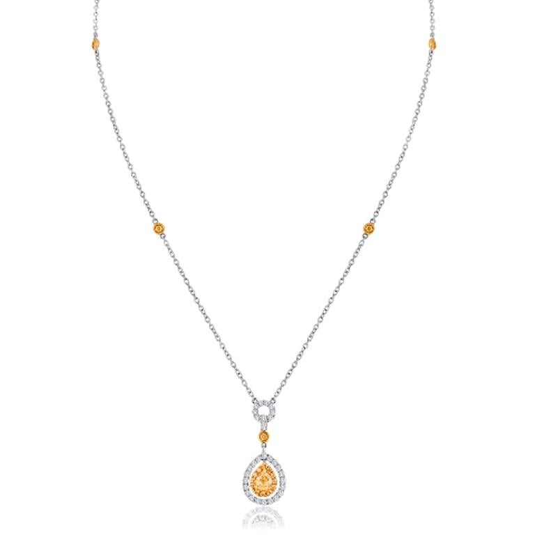 Gorgeous Natural Fancy Yellow Diamond Pear SI Clarity 0.58 Carat encircled in a double Halo of Natural Fancy Yellow Diamond SI Clarity 0.45 Carat and White Colorless Diamond Rounds VS-SI Clarity 0.53 Carat
in 18K White and Yellow Gold Drop Necklace