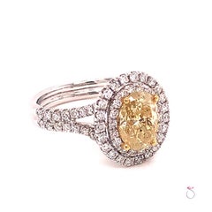 Natural Fancy Yellow Oval Diamond Halo Ring, 1.60 Carat, 18 Karat 2.34 Carat