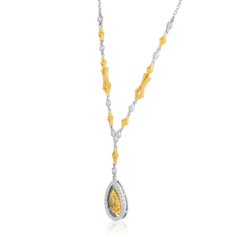 Stunning Natural Fancy Yellow Pear Shape Diamond 1.04 Carat Encircled in a Double Halo of Natural Fancy Yellow Diamond Round 0.48 Carat and  White Diamond Round 0.80 Carat in 18K White and Yellow Gold Drop Pendant Diamond By Yard Necklace.

Style