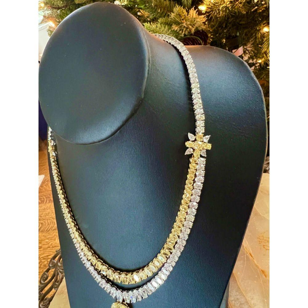 Natural Fancy Yellow & White Diamond Platinum/18K Yellow Gold Necklace

This stunning 53.12 carat yellow and white diamond necklace is to die for! The centerpiece of this necklace is a 1.34 carat pear shaped diamond, with I color and VS1 clarity.