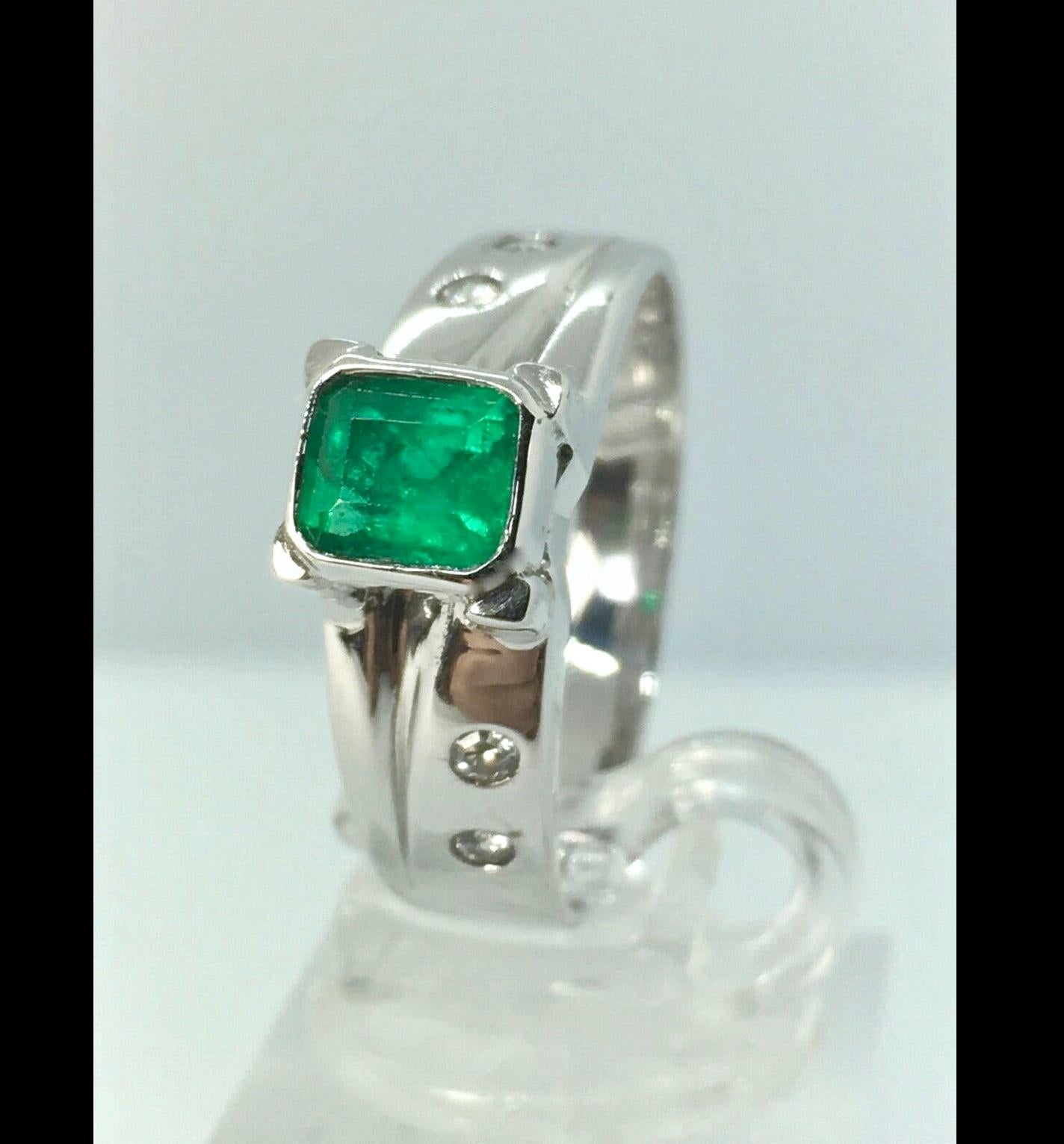 Emerald and Diamonds  Ring
Mounting Is Custom Made of Solid 18K W.G
 
Center
Natural Colombian Emerald 
1.00 carat
Vivid Medium Green
Side
Diamonds
0.20 Cts
Clarity  VS1
Color F/G
Weight   5.15g
Ring Size 8.5