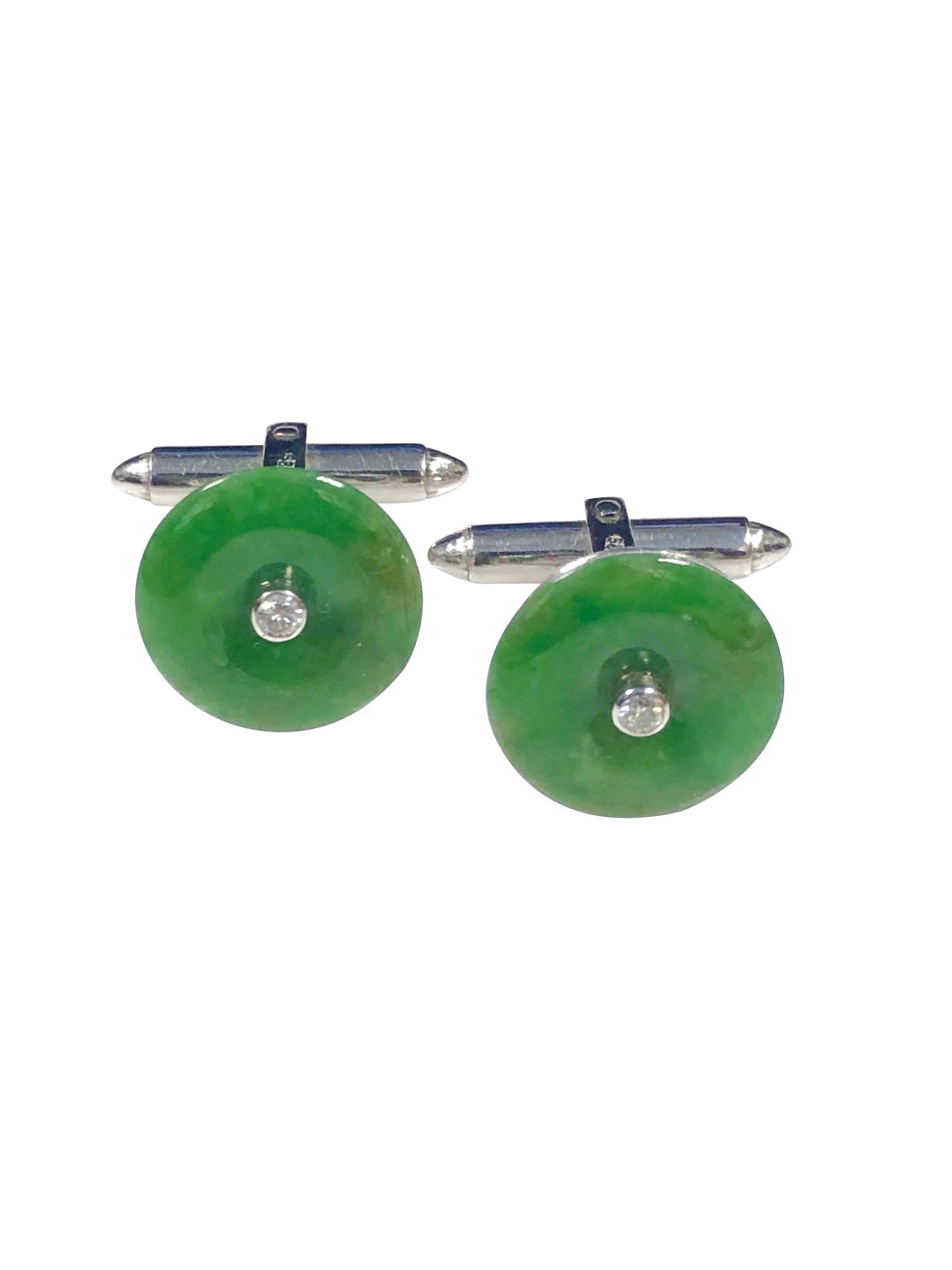 Circa 1970s Jade Cufflinks, set in 18K White Gold and Having Chinese stamping's The Jade tops measure 5/8 inch in diameter and are centrally set with .05 Carat Round Brilliant cut Diamond. The Jade is Natural untreated and Grades as A. The Cufflinks