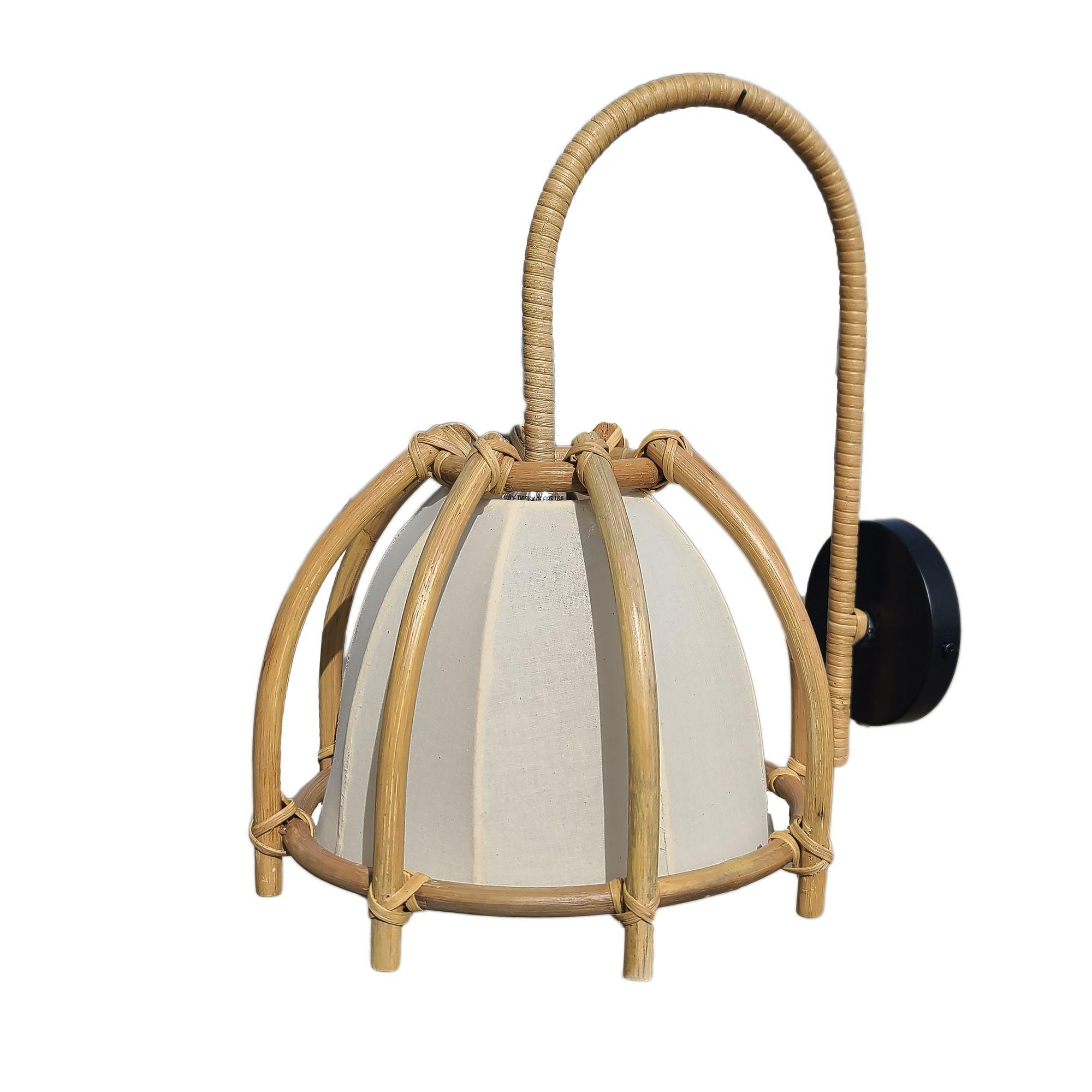 Original Natural finish 1990s rattan wall sconce perfect to add a little warmth to a modern house. The pendant features a stick rattan skeleton shade hung from a slit rattan-wrapped rod connected to a black wall plate.
Sold as a